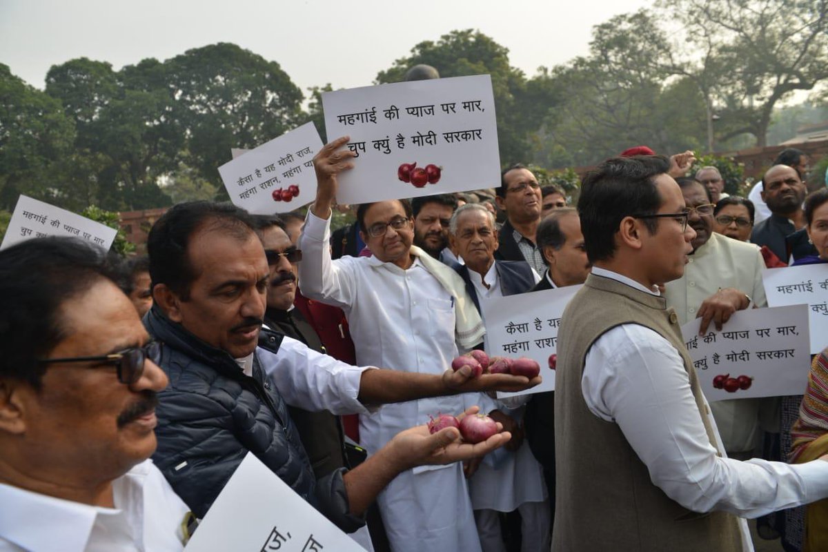 Leaders of the Congress Party protest outside Parliament against the rising Onion prices