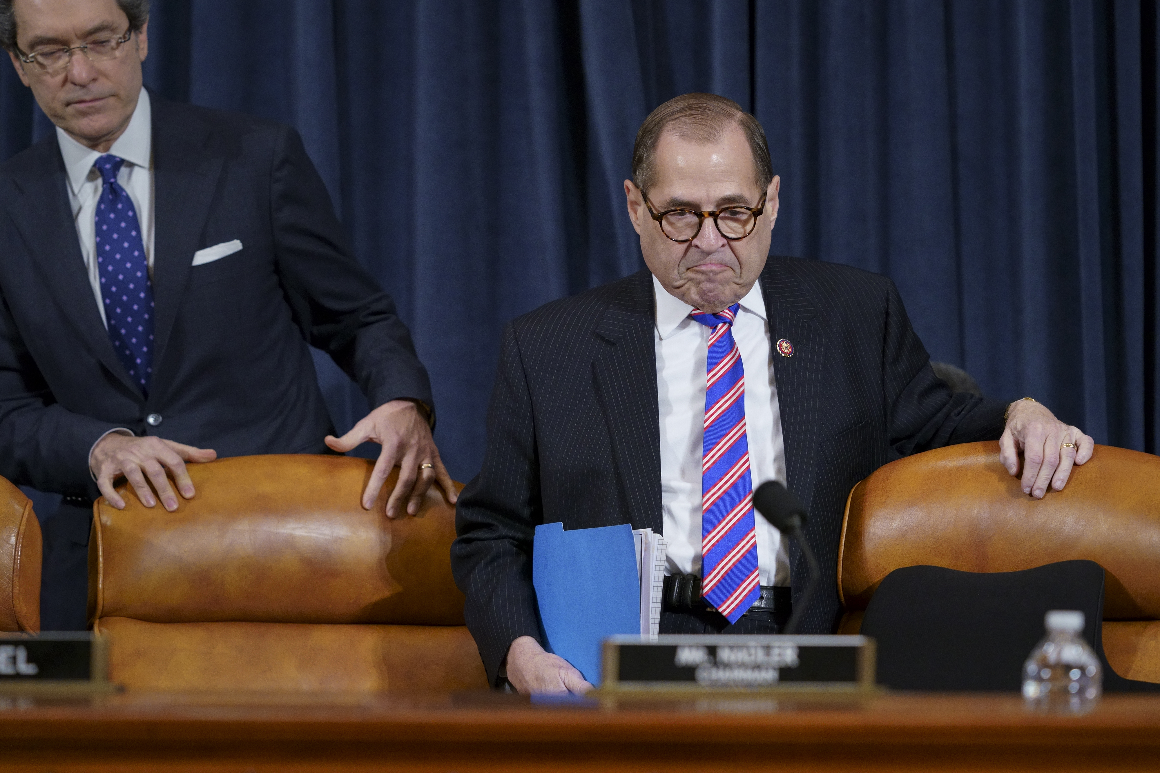 House Judiciary Committee Chairman Rep. Jerrold Nadler, joined at left by Democratic counsel Norm Eisen, arrives at a hearing on the constitutional grounds for the impeachment of President Donald Trump, on Capitol Hill in Washington, on Wednesday.