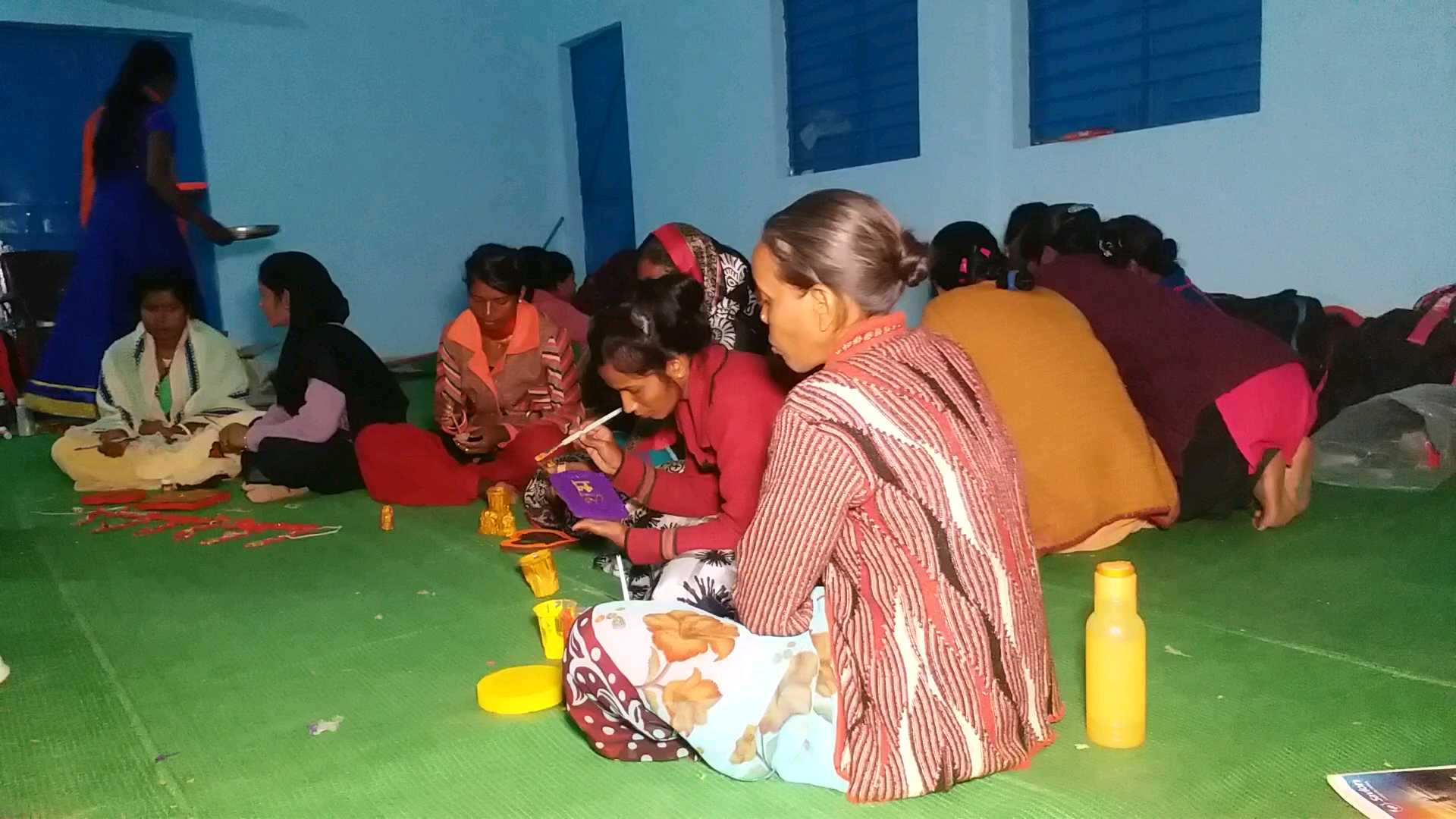 Women of Ambikapur making clock with cow dung