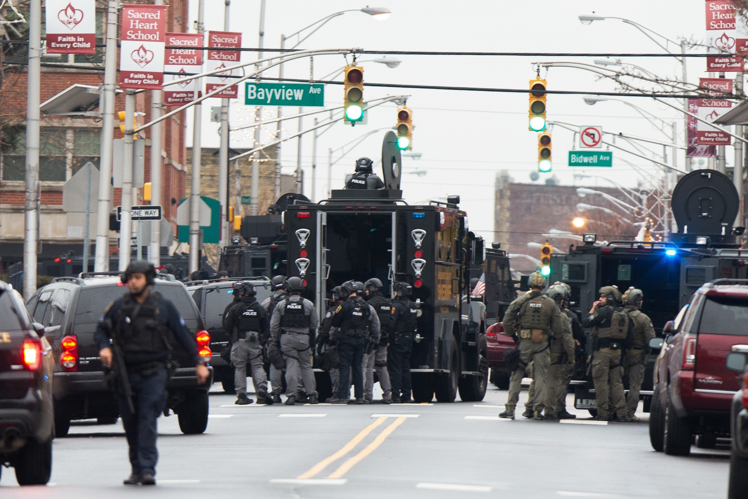 Law enforcement arrive on the scene following reports of shooting, on Tuesday.