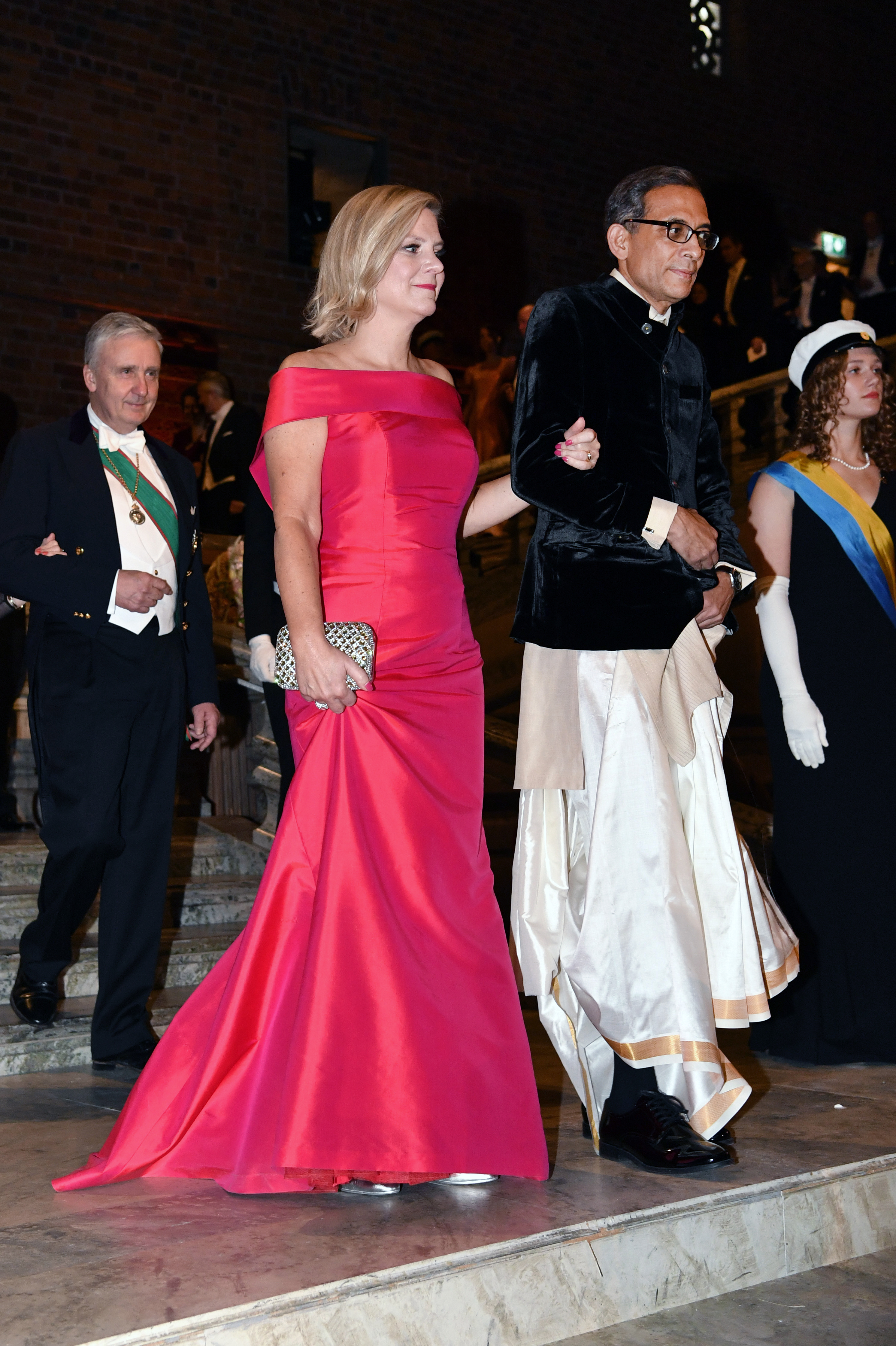 Swedish finance minister Magdalena Andersson and economics laureate Abhijit Banerjee arrive to the Nobel banquet at Stockholm City Hall in Stockholm on Tuesday.