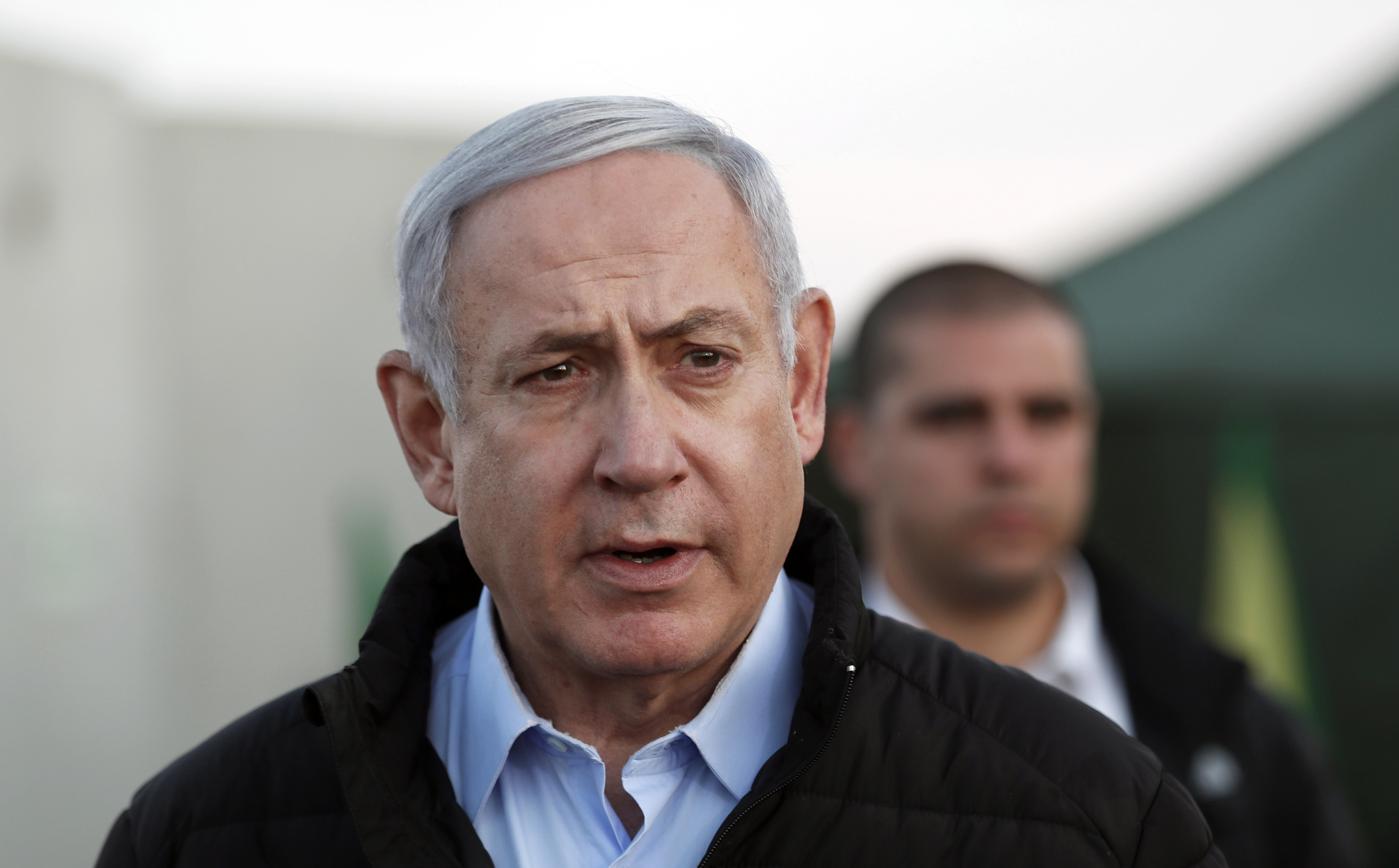 Israeli Prime Minister Benjamin Netanyahu, looks on during a visit to Israeli army base in the Golan Heights located on the Israeli-Syrian border.