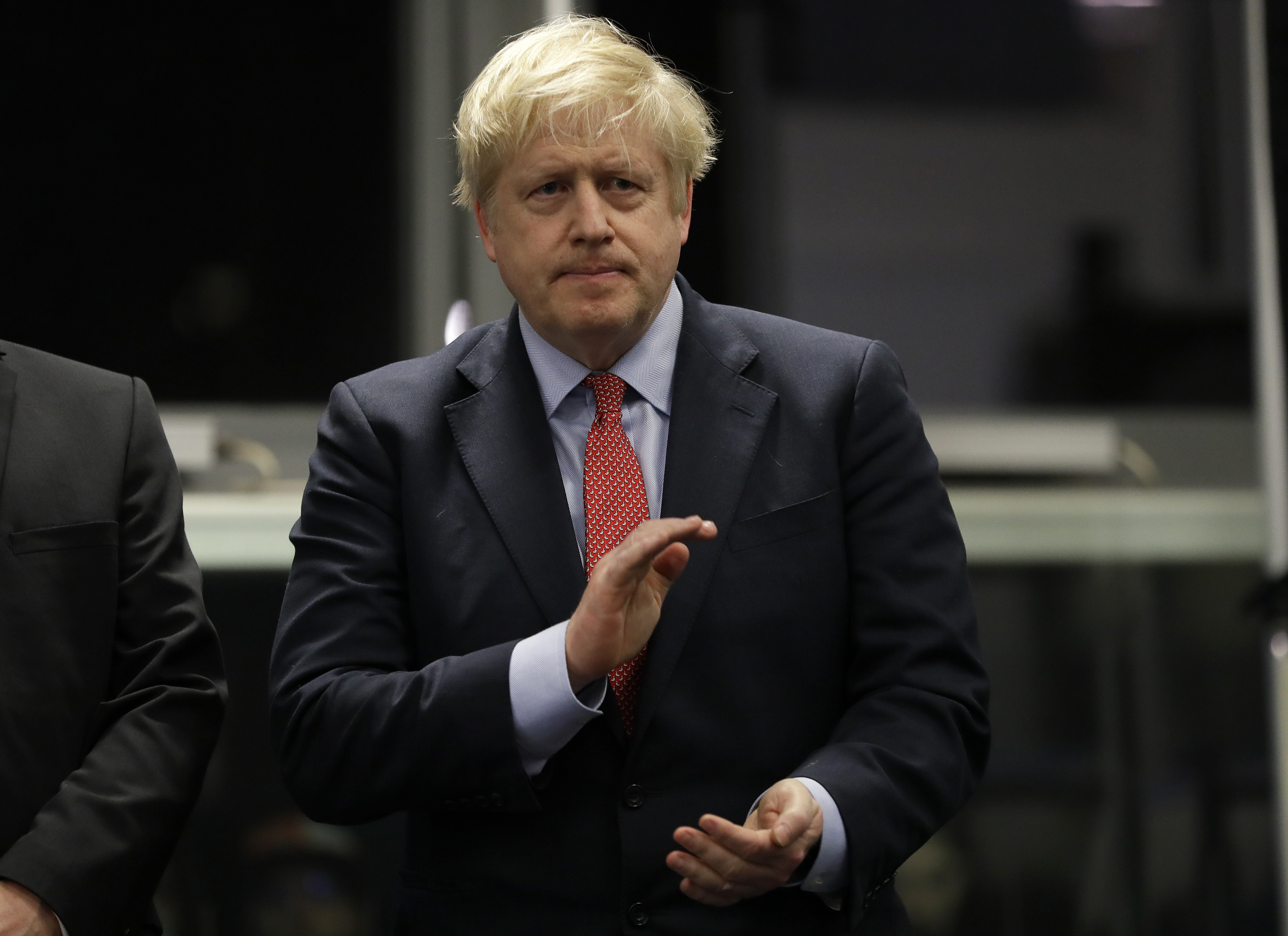 Britain's Prime Minister and Conservative Party leader Boris Johnson applauds during the Uxbridge and South Ruislip constituency count declaration at Brunel University in London, on Friday.