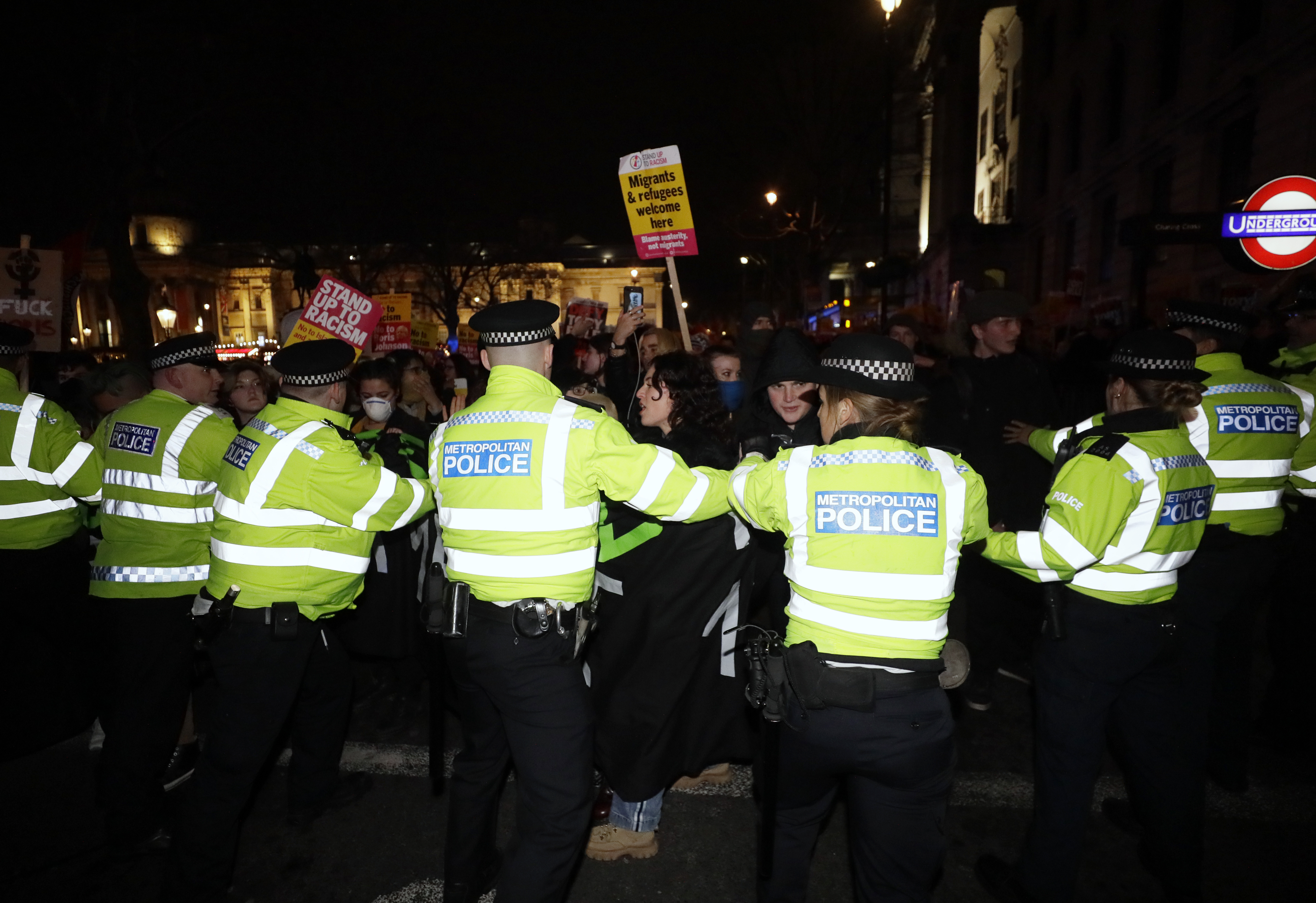 People scuffle with police during an anti-Boris Johnson demonstration at Trafalgar Square in central London, on Friday.