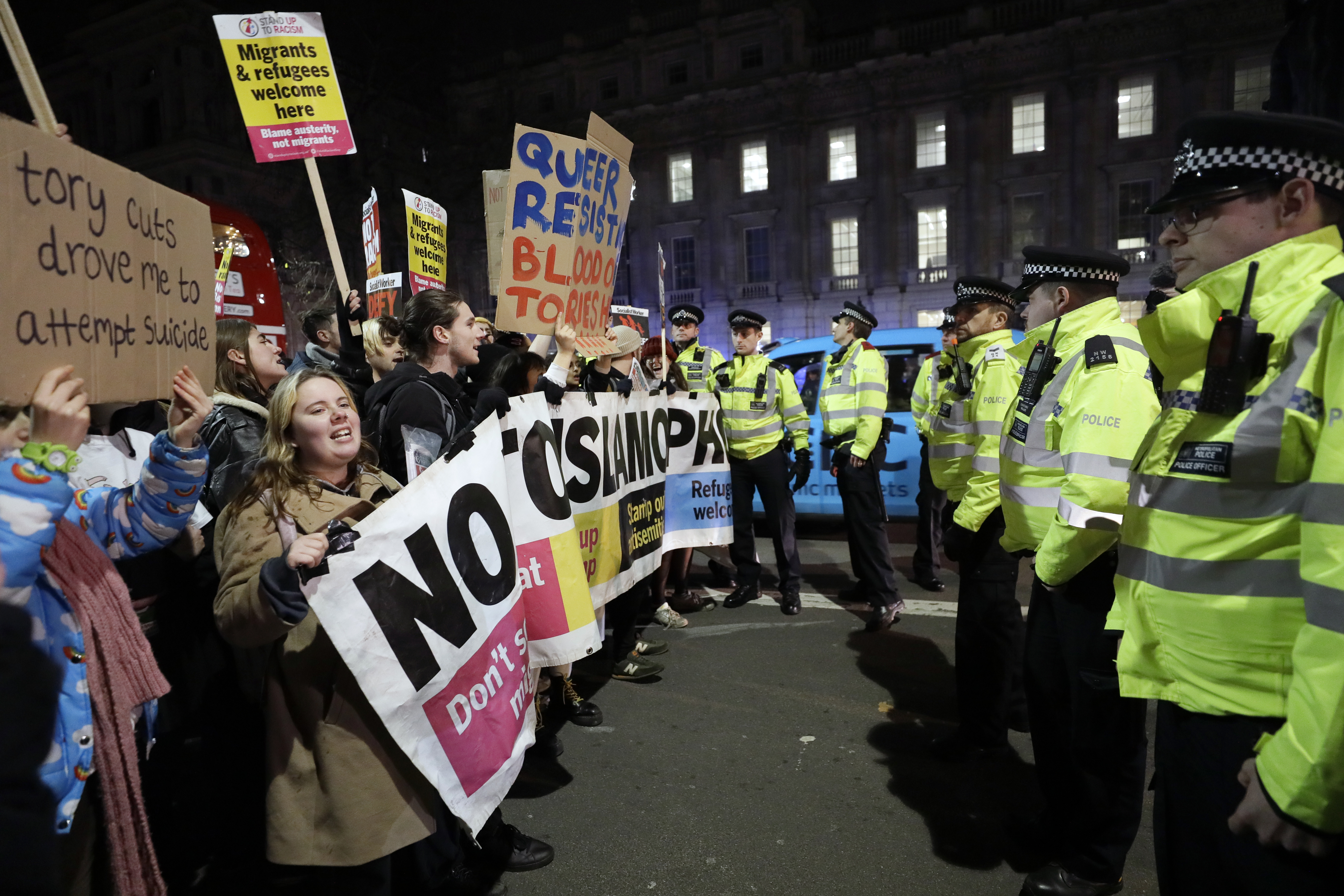 People attend an anti-Boris Johnson demonstration in central London, on Friday.