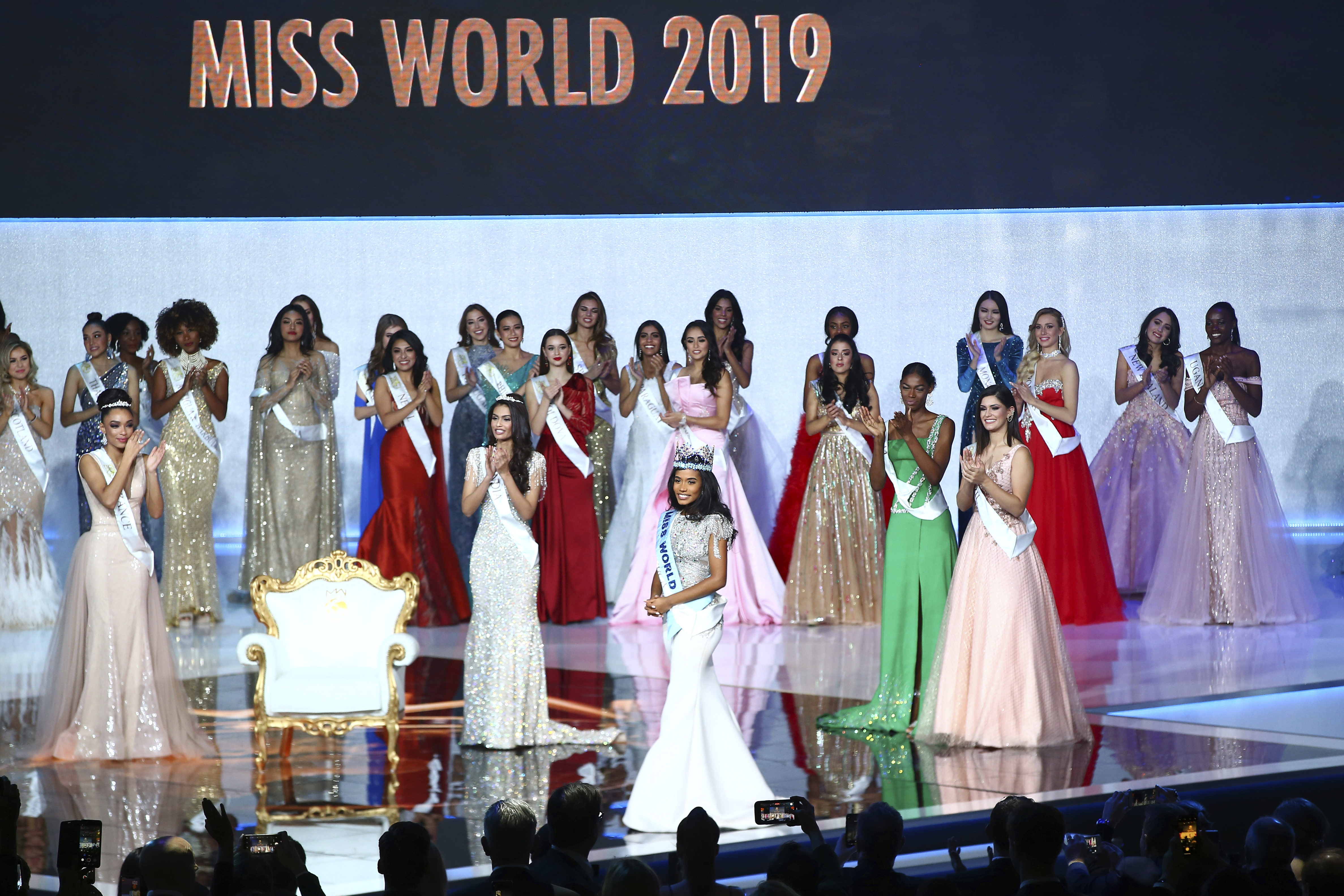 Winner of Miss World 2019, Toni-Ann Singh of Jamaica, front centre, is applauded at the 69th annual Miss World competition at the Excel centre in London Saturday.