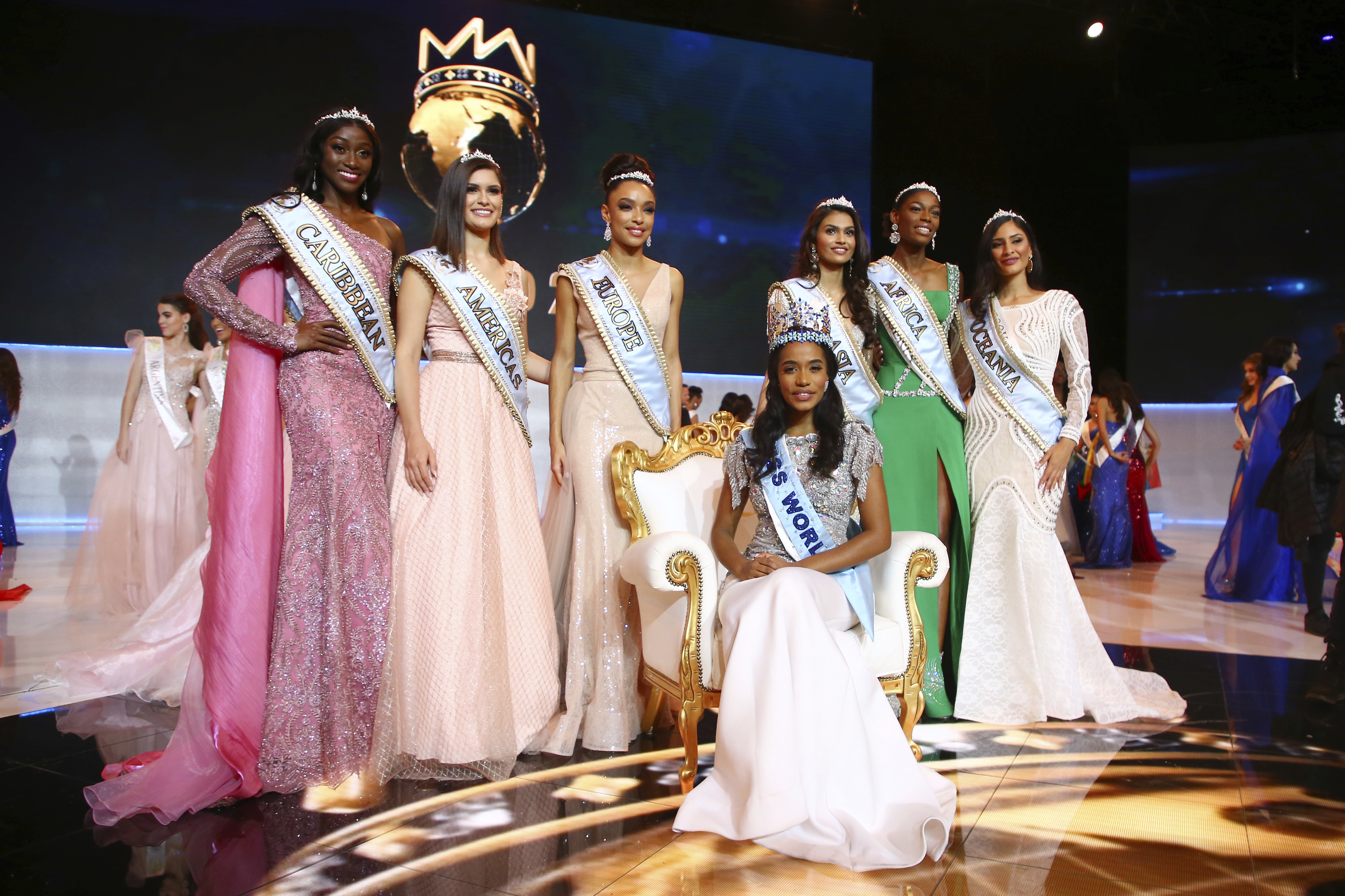 Winner of Miss World 2019, Toni-Ann Singh of Jamaica, front centre, poses for photographers in front of the other finalists, at the 69th annual Miss World competition at the Excel centre in London Saturday.