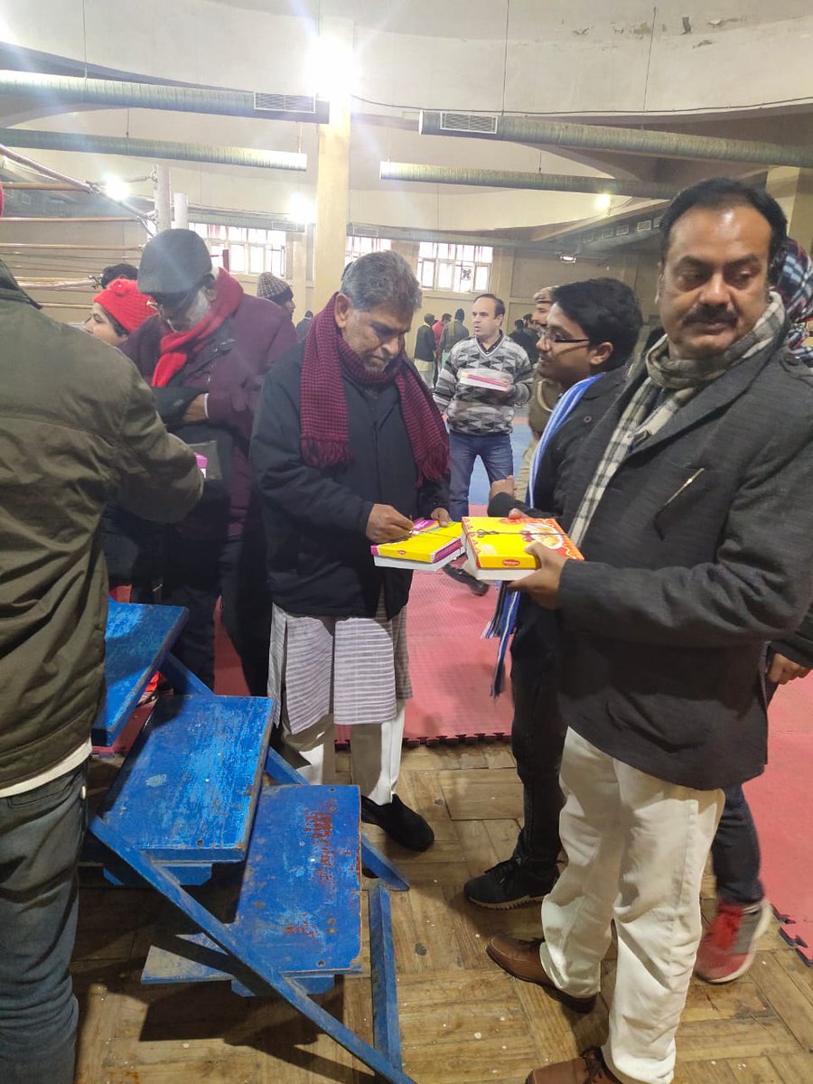 Police personnel offer refreshments to CAA protesters at Rajiv Gandhi Stadium.