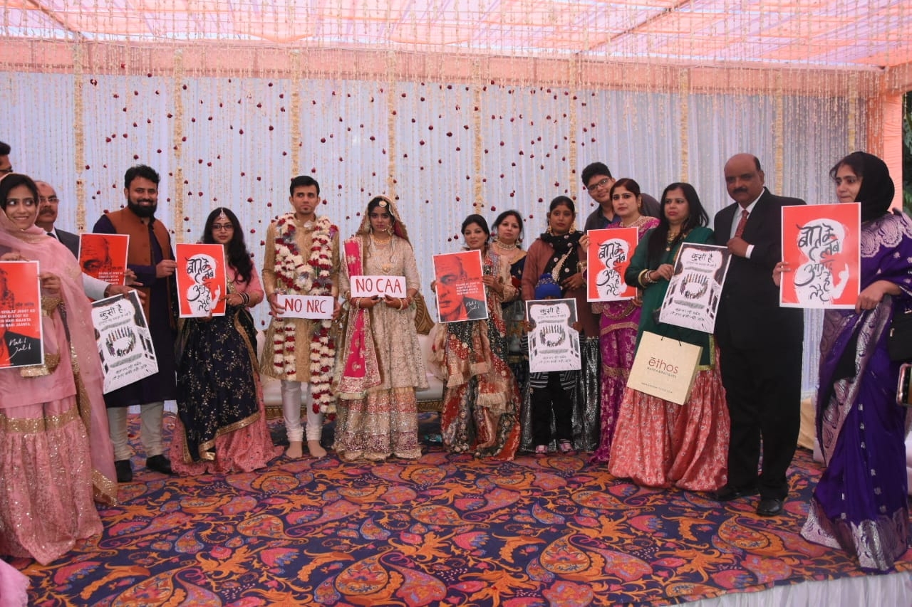 Jamia student, groom pose with anti-CAA placards during wedding