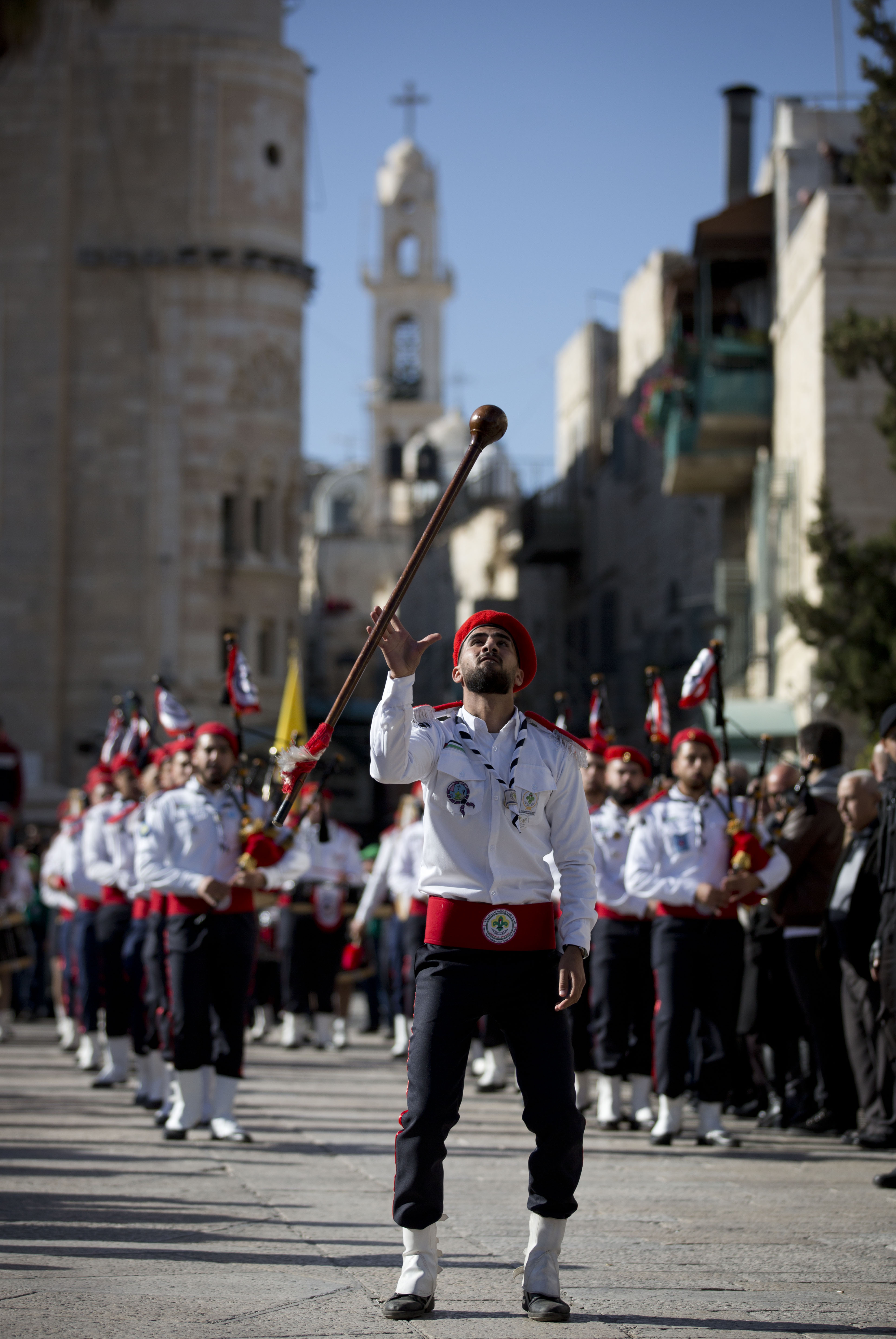 6. A Palestinian Scout marching band parade during Christmas celebrations outside the Church of the Nativity, built atop the site where Christians believe Jesus Christ was born, on Christmas Eve, in the West Bank City of Bethlehem