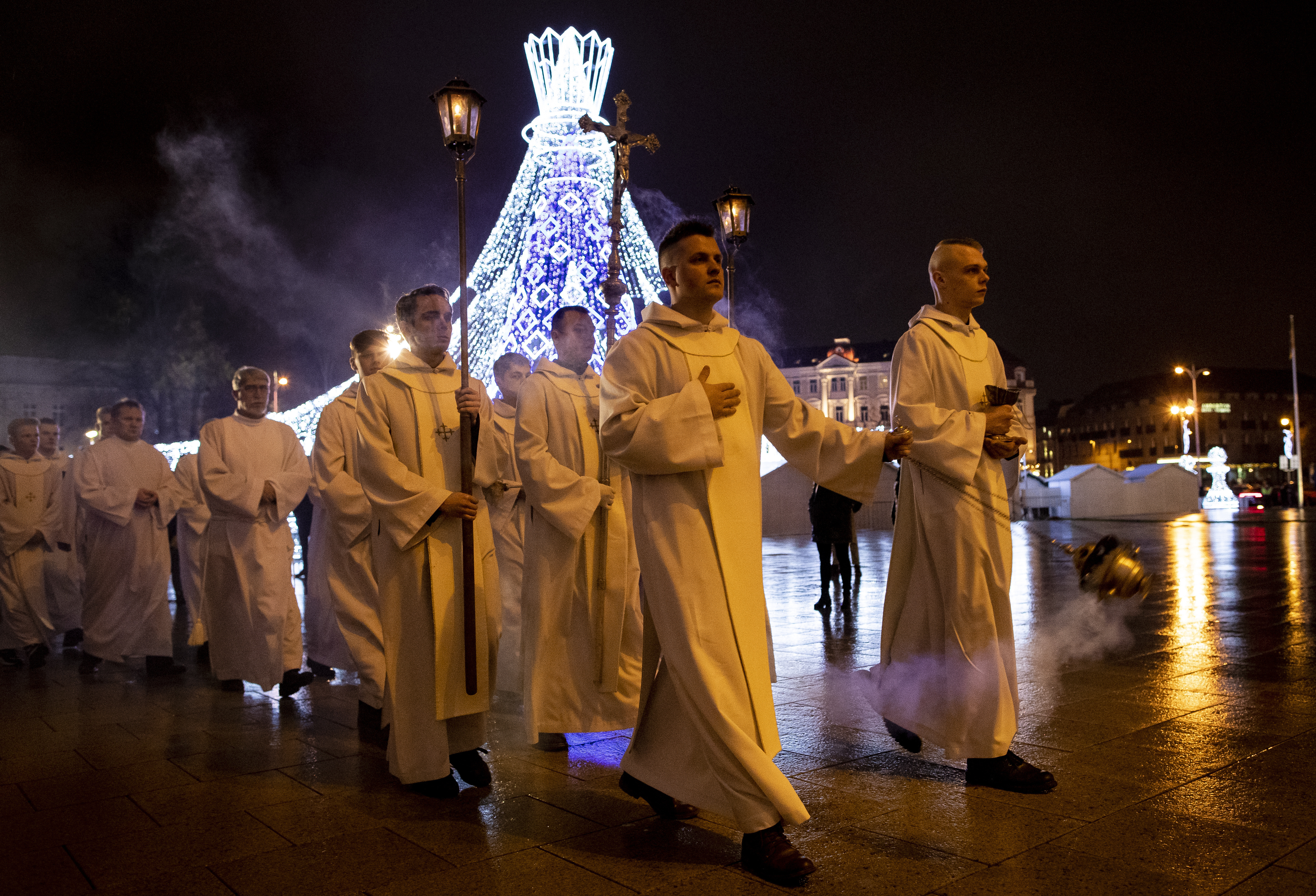 Priests and clergy walk in a procession to attend the Christmas celebration midnight Mass at the Cathedral-Basilical in Vilnius, Lithuania