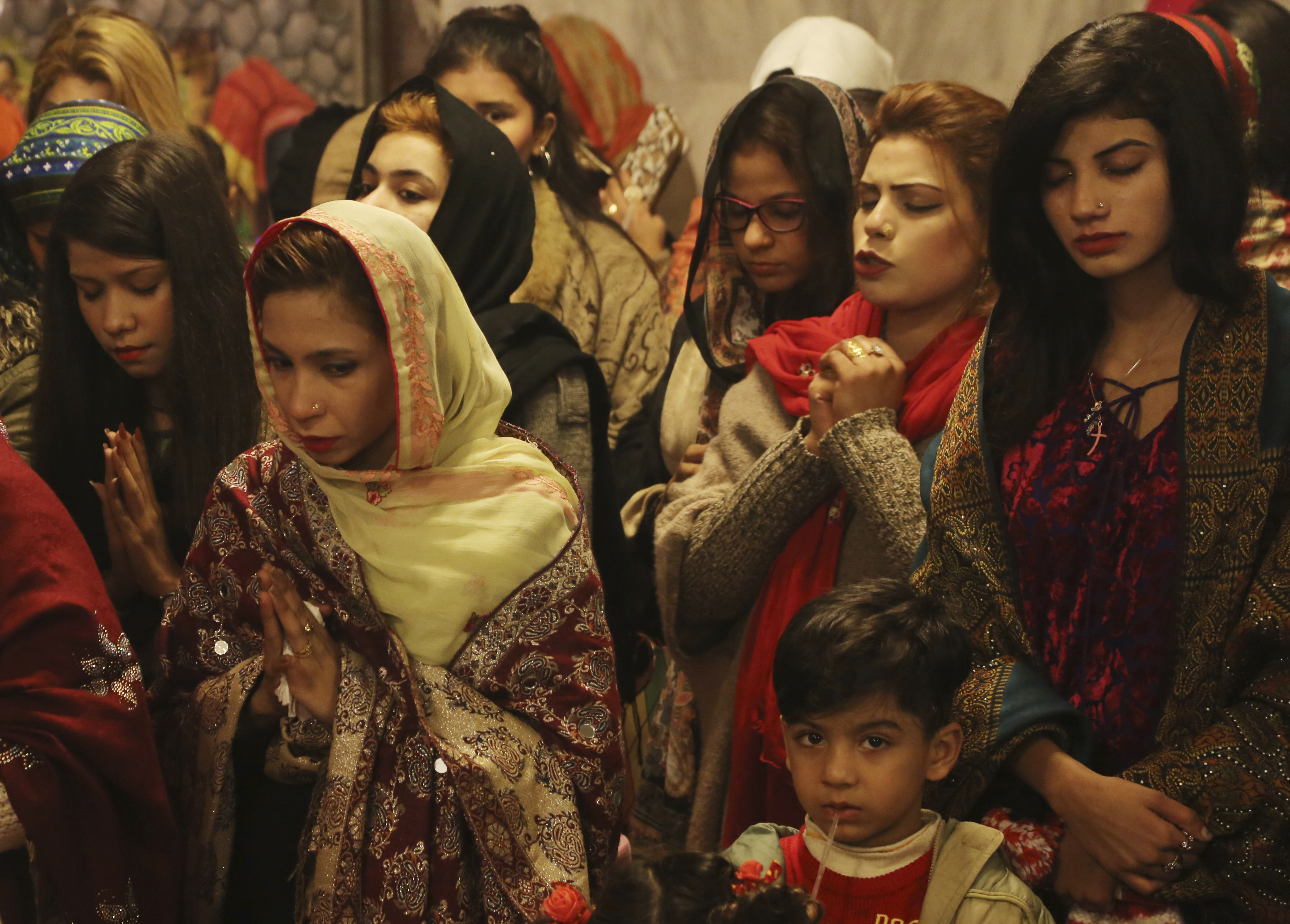 Pakistani Christians attend midnight services at St. Anthony's Church to celebrate Christmas in Lahore.