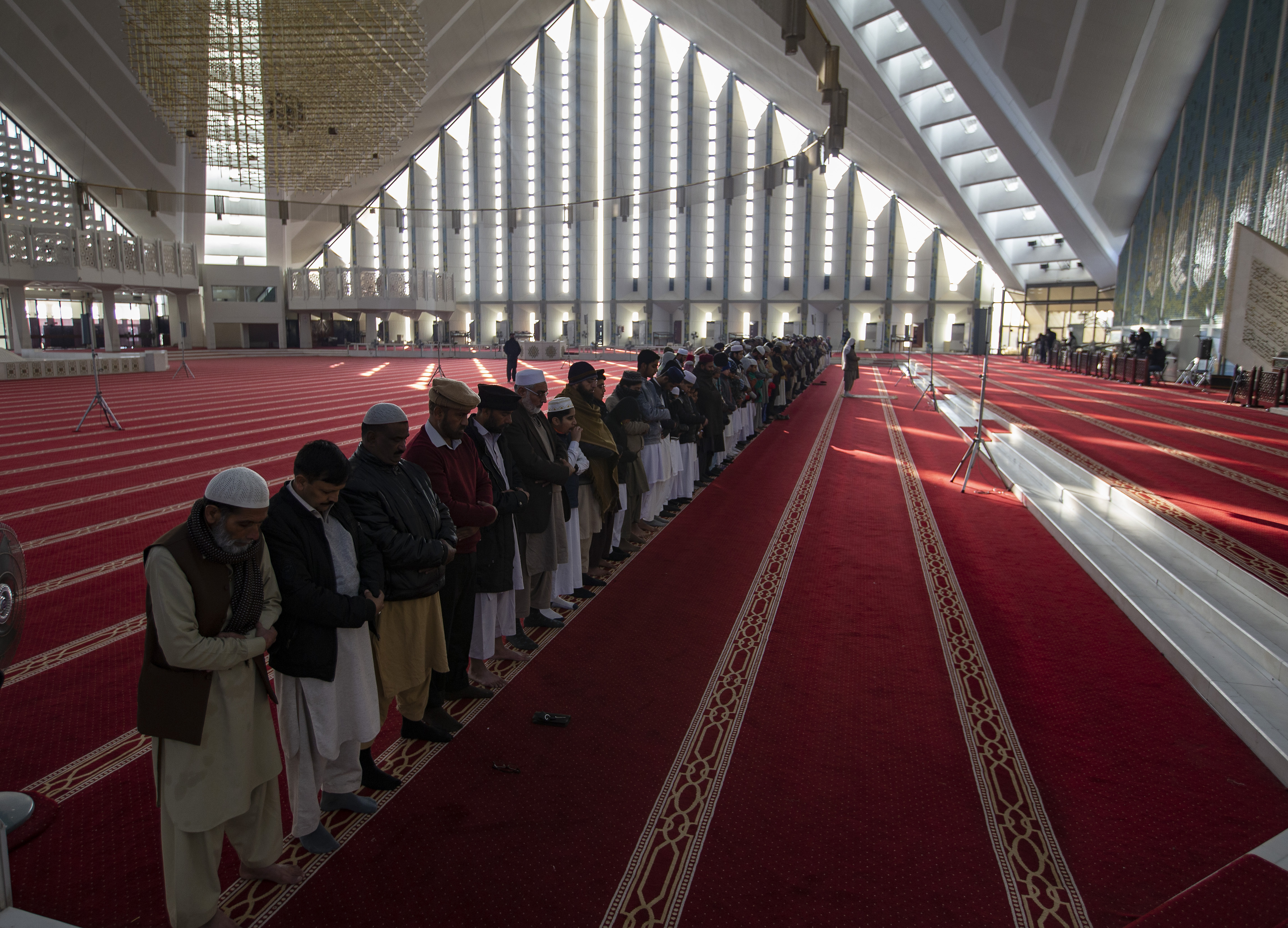 People offer special 'Kusoof' prayers at the Faisal mosque during a solar eclipse in Islamabad, on Thursday.