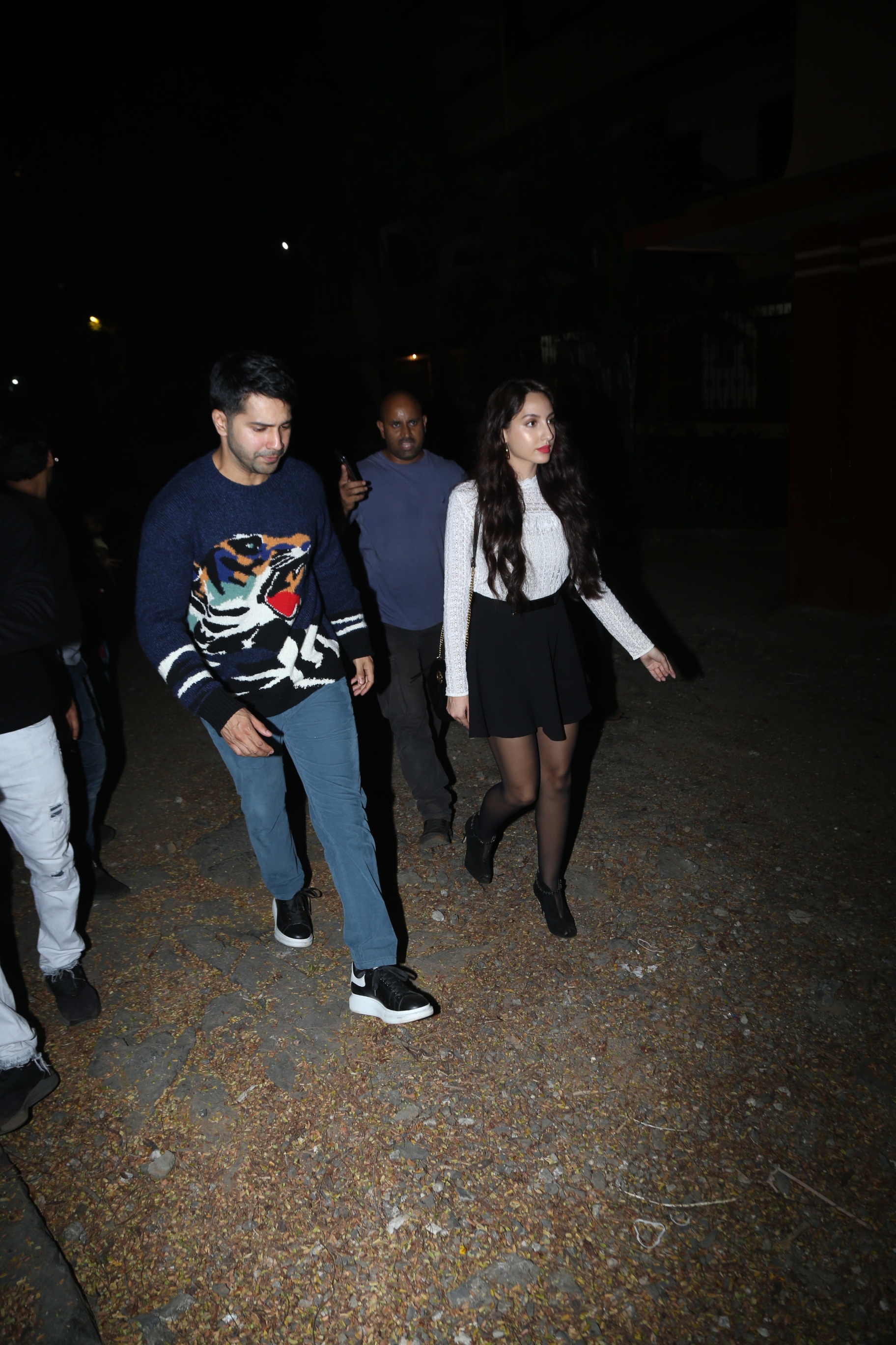 Varun Dhawan protects Nora Fatehi from mob frenzy