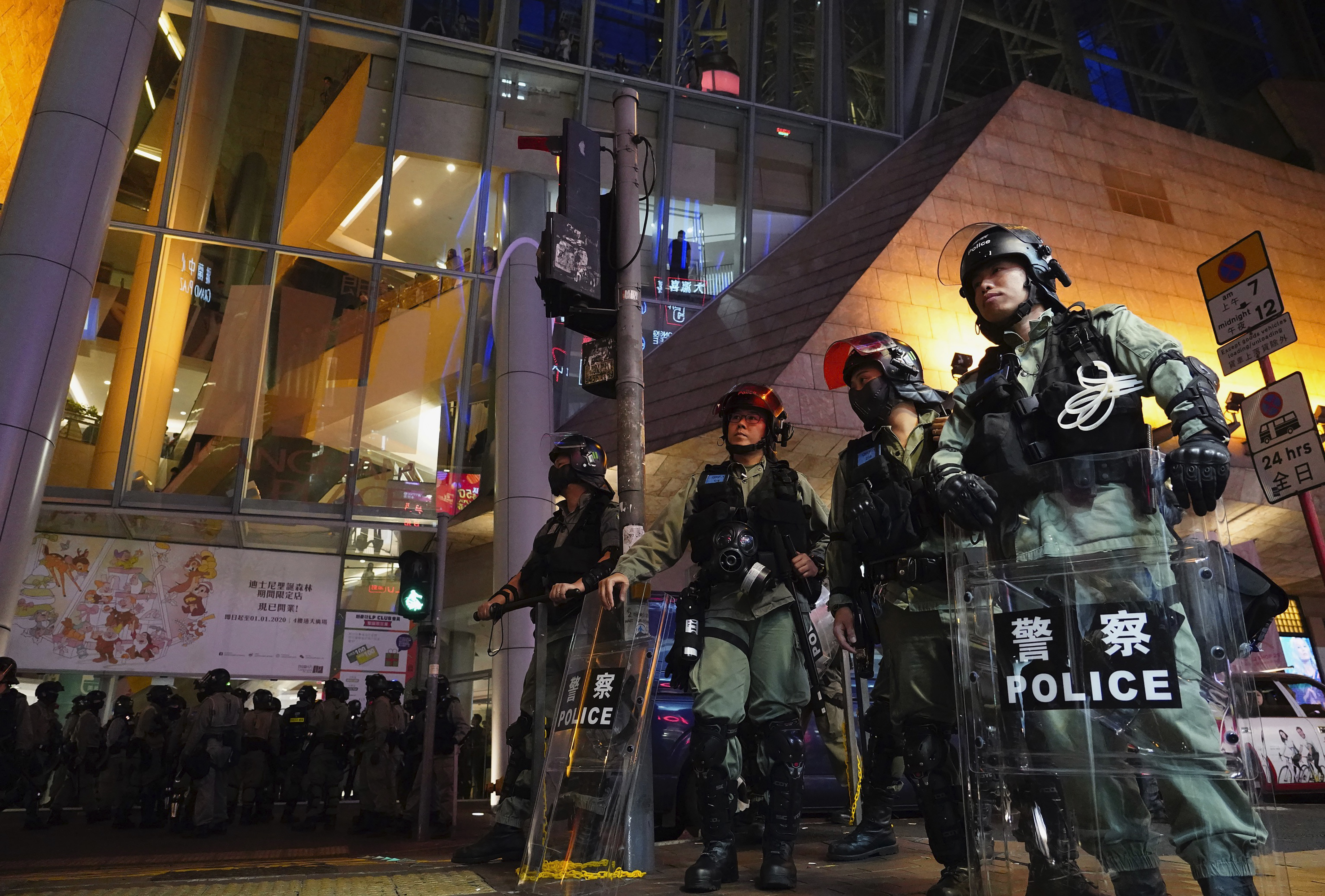 Riot police gather near a shopping mall during a demonstration in Hong Kong, on Thursday.