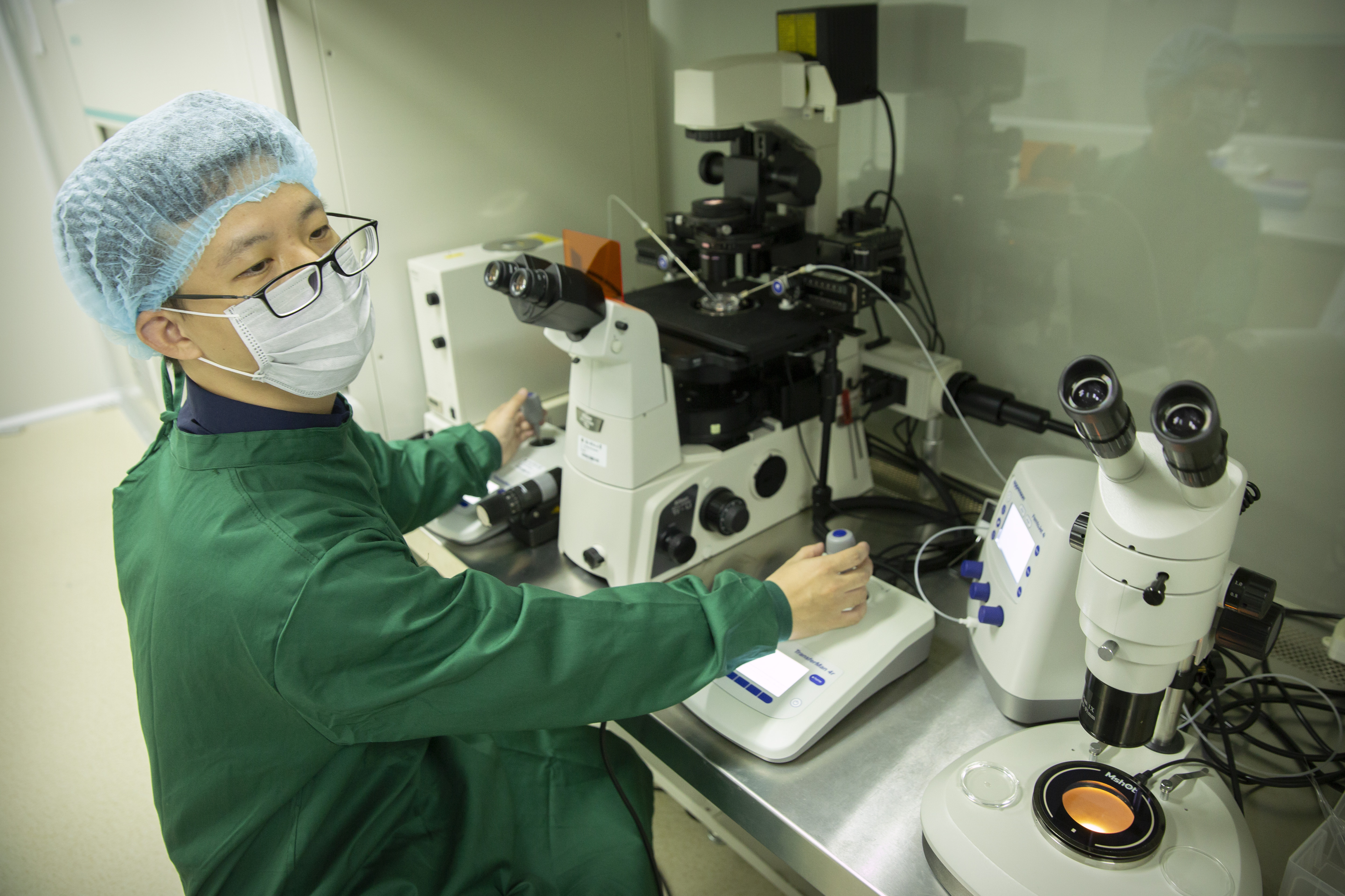 Chinese scientist Qin Jinzhou works with embryos in a laboratory in Shenzhen in southern China's Guangdong Province.