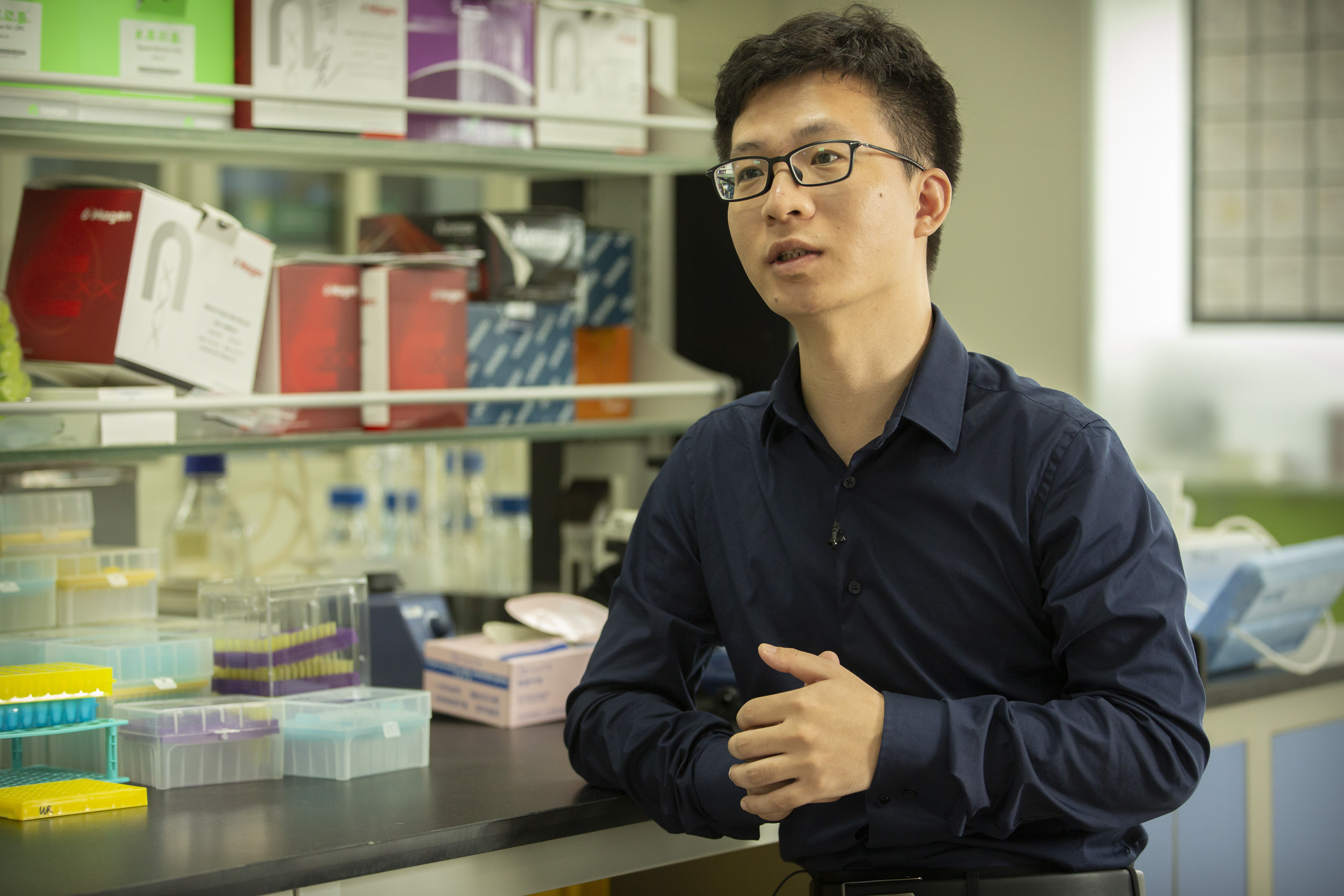 Chinese scientist Qin Jinzhou speaks during an interview with the Associated Press in a laboratory in Shenzhen in southern China's Guangdong Province.