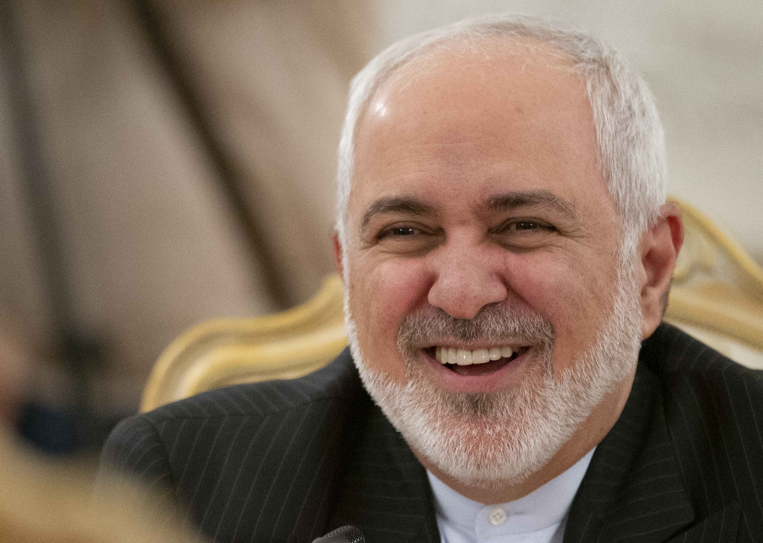 Iranian Foreign Minister Mohammad Javad Zarif smiles as he speaks to Russian Foreign Minister Sergey Lavrov during their talks in Moscow, Russia, on Monday.