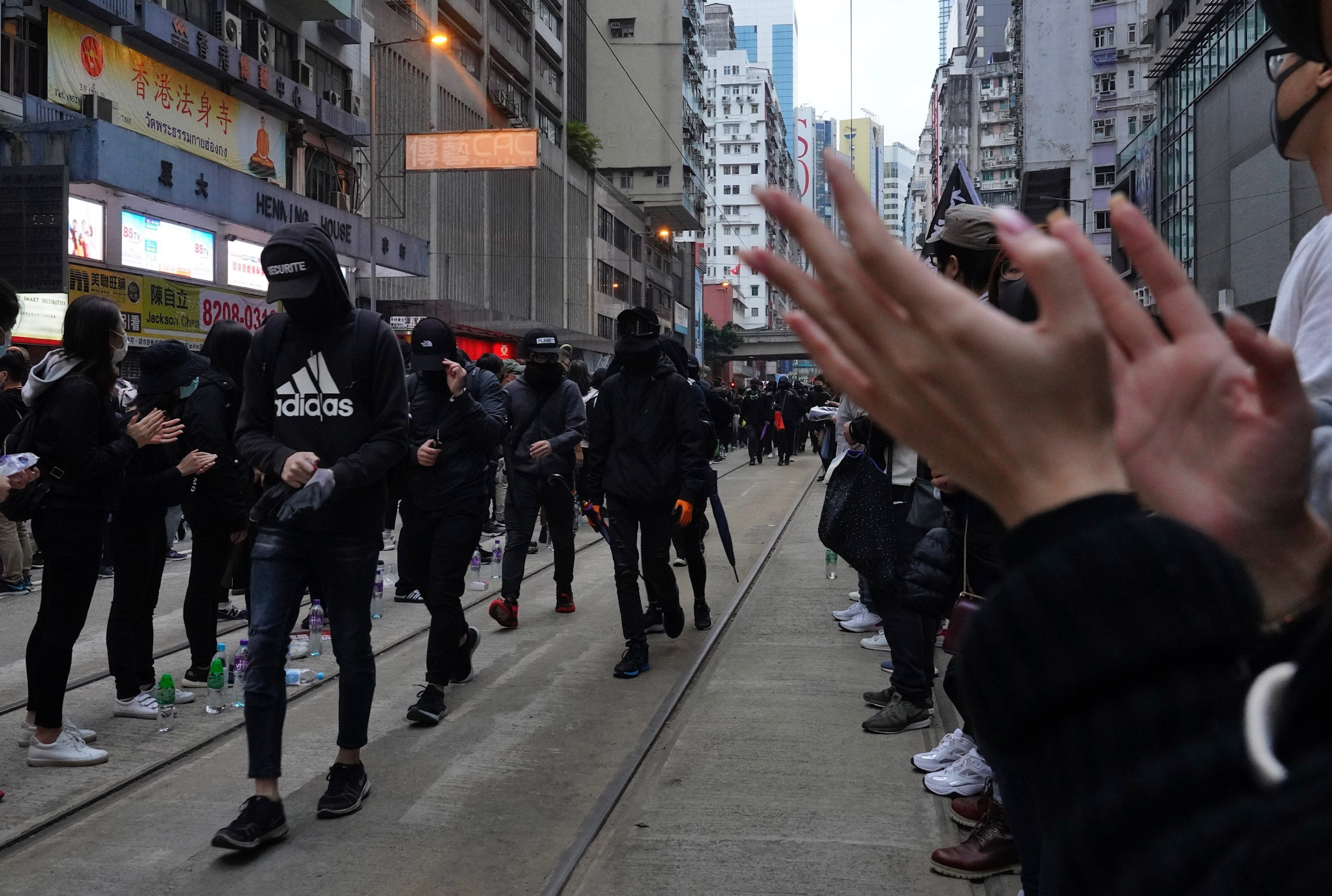 Hong Kong people participate in their annual pro-democracy march to insist their five demands be matched by the government in Hong Kong, on Wednesday.