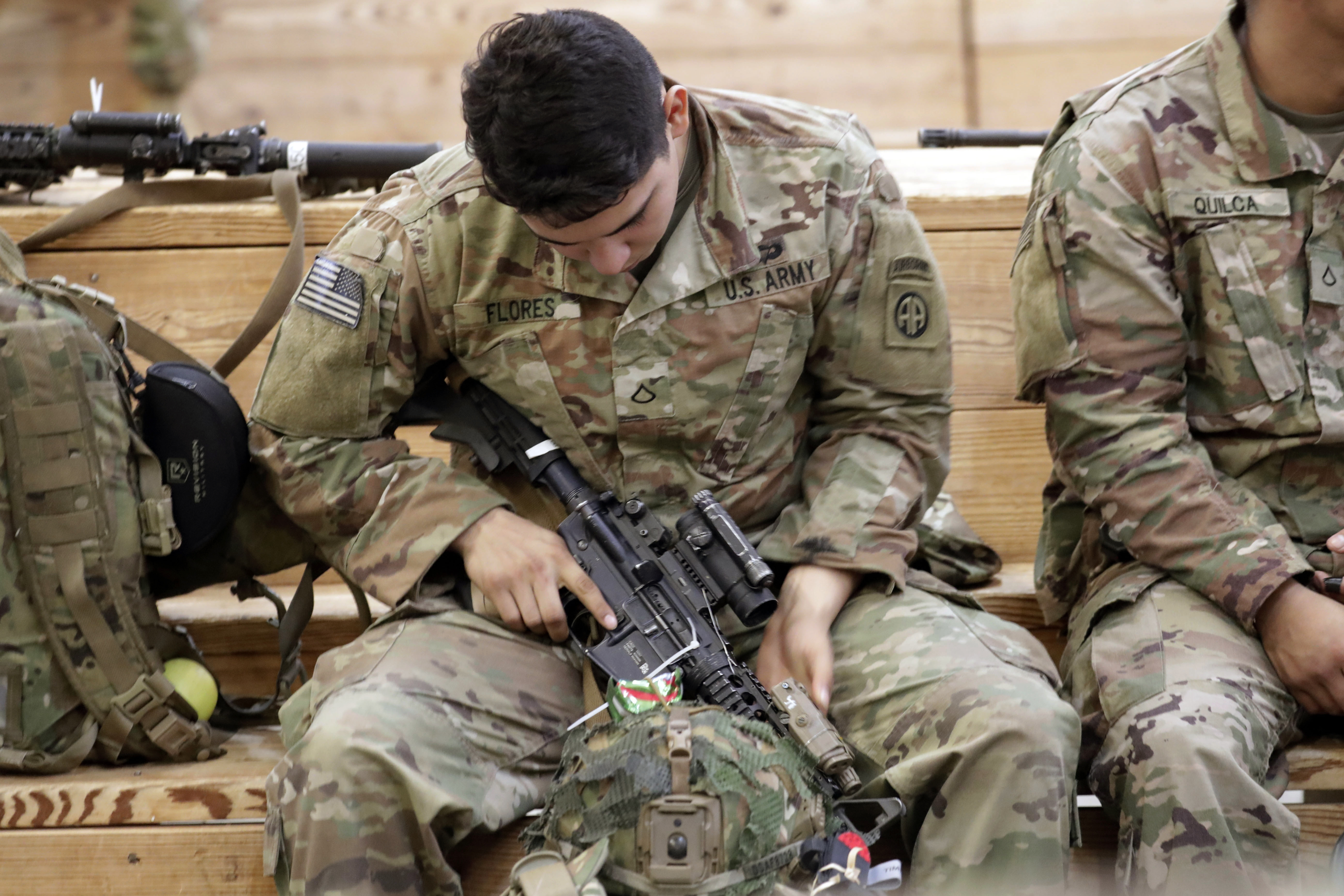 A U.S. Army soldier checks his rifle before heading out Saturday at Fort Bragg, N.C.