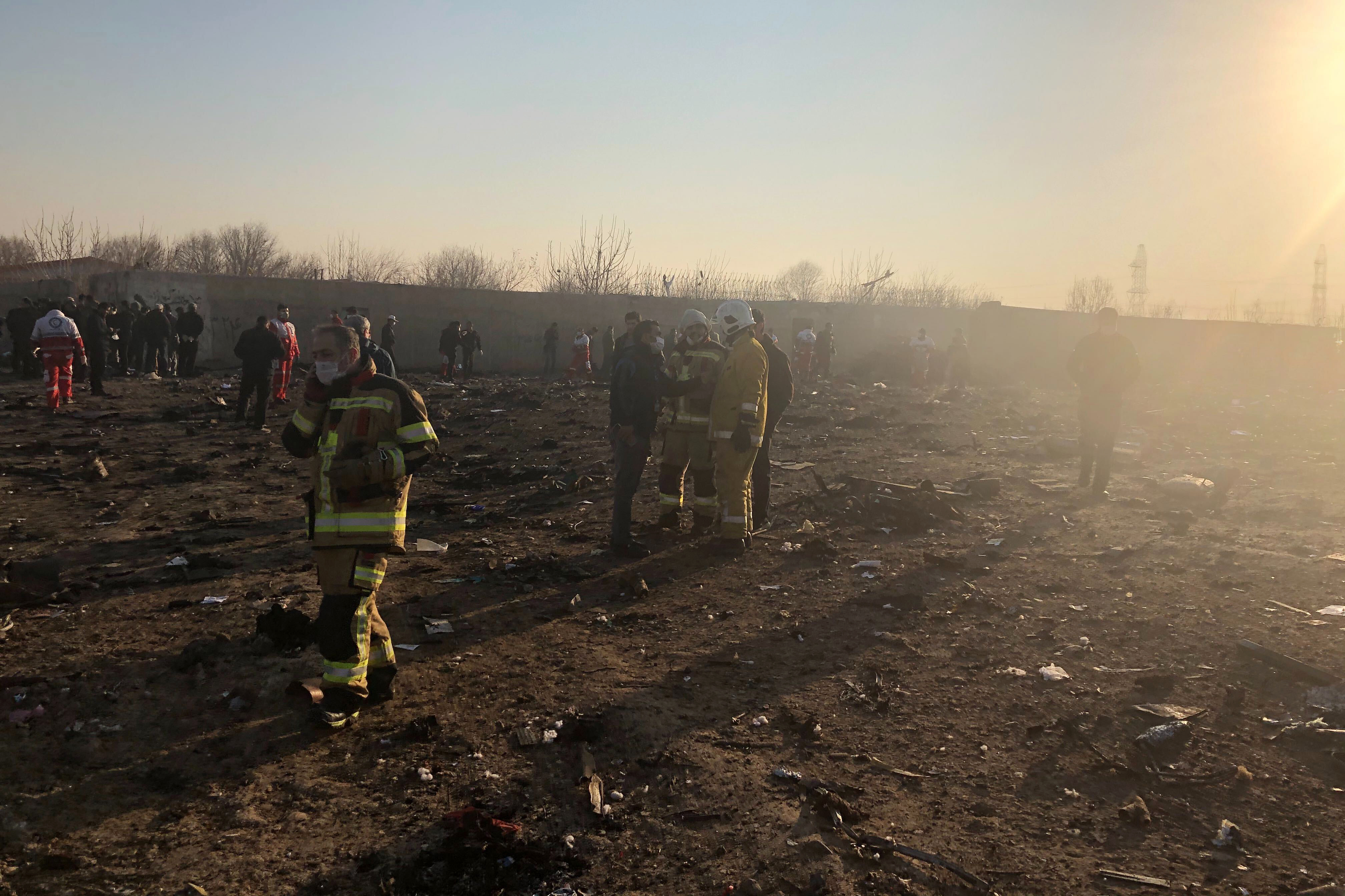 Debris is seen from a plane crash on the outskirts of Tehran, on Wednesday.