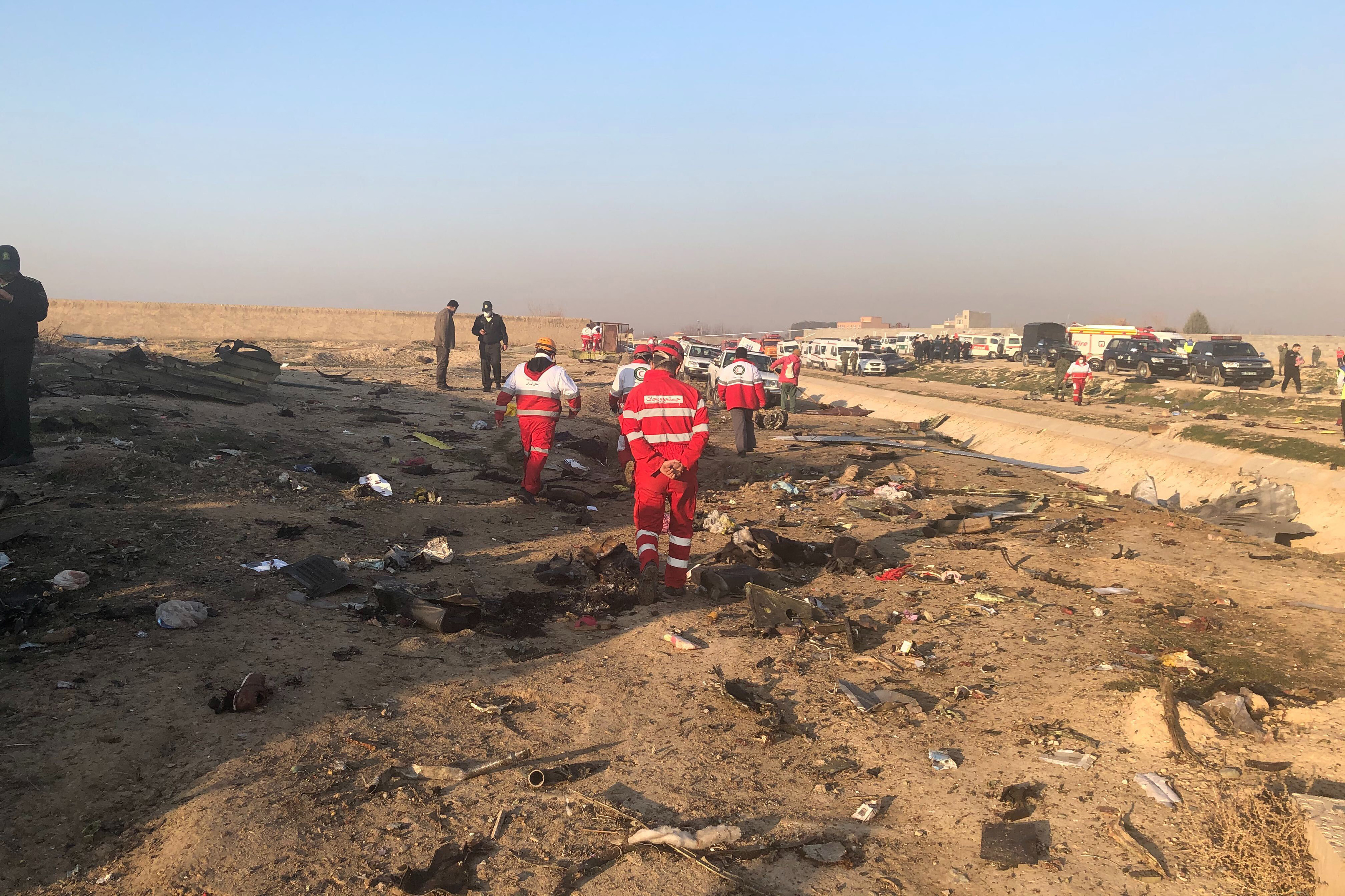 Debris is seen from a plane crash on the outskirts of Tehran, on Wednesday.