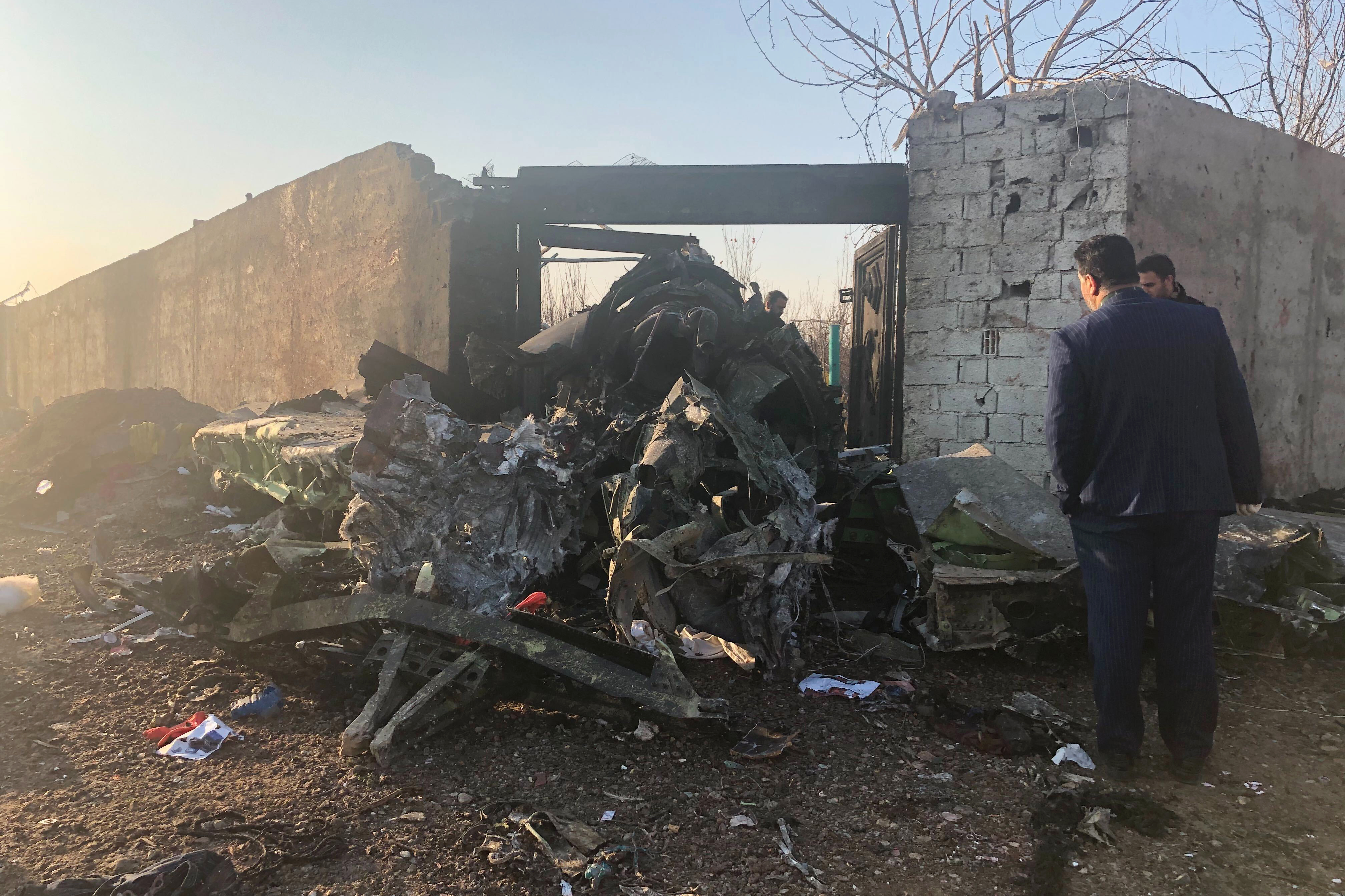 Debris is seen from a plane crash on the outskirts of Tehran, on Wednesday.