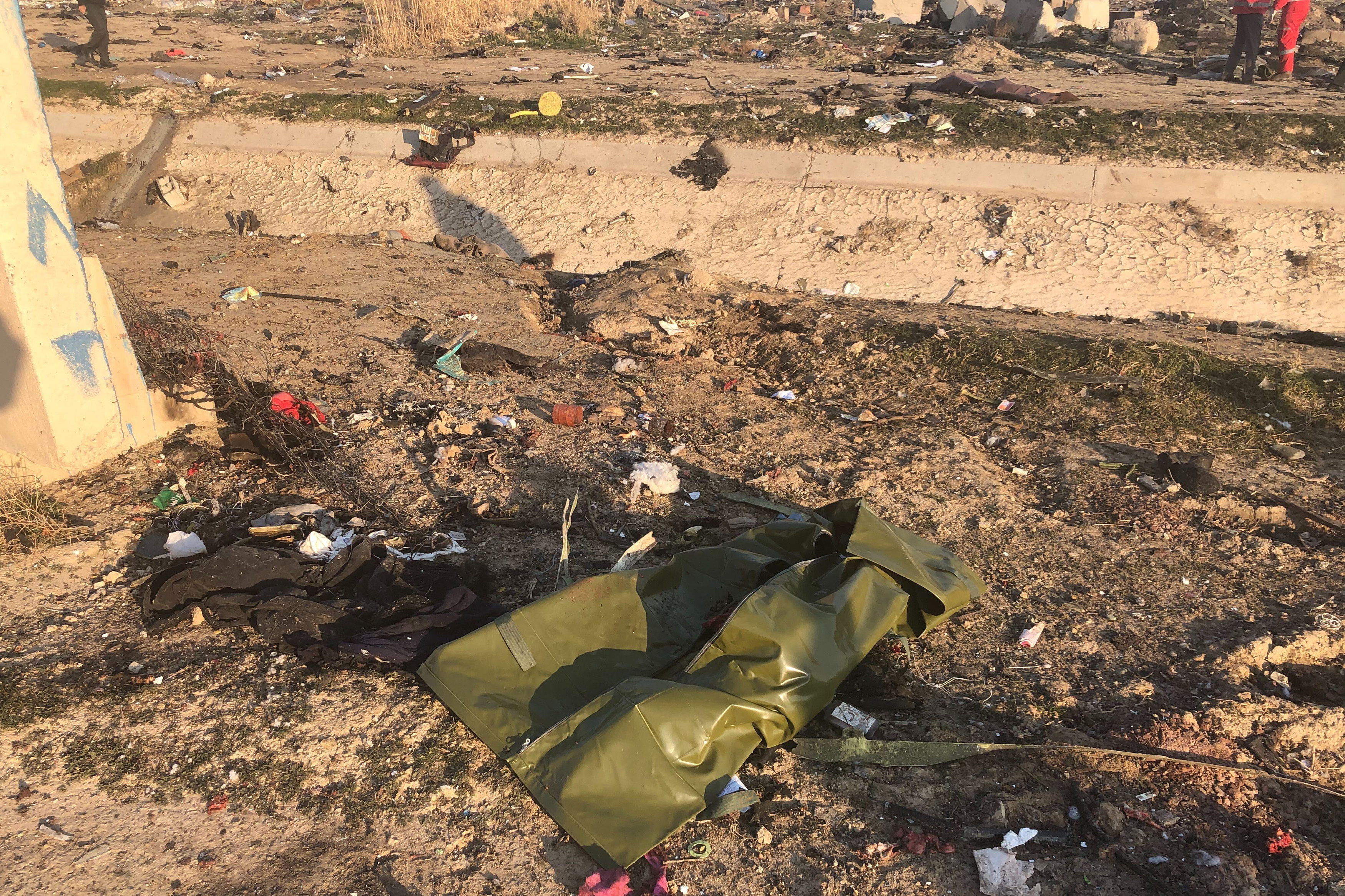 Debris is seen from a plane crash on the outskirts of Tehran, on Wednesday.