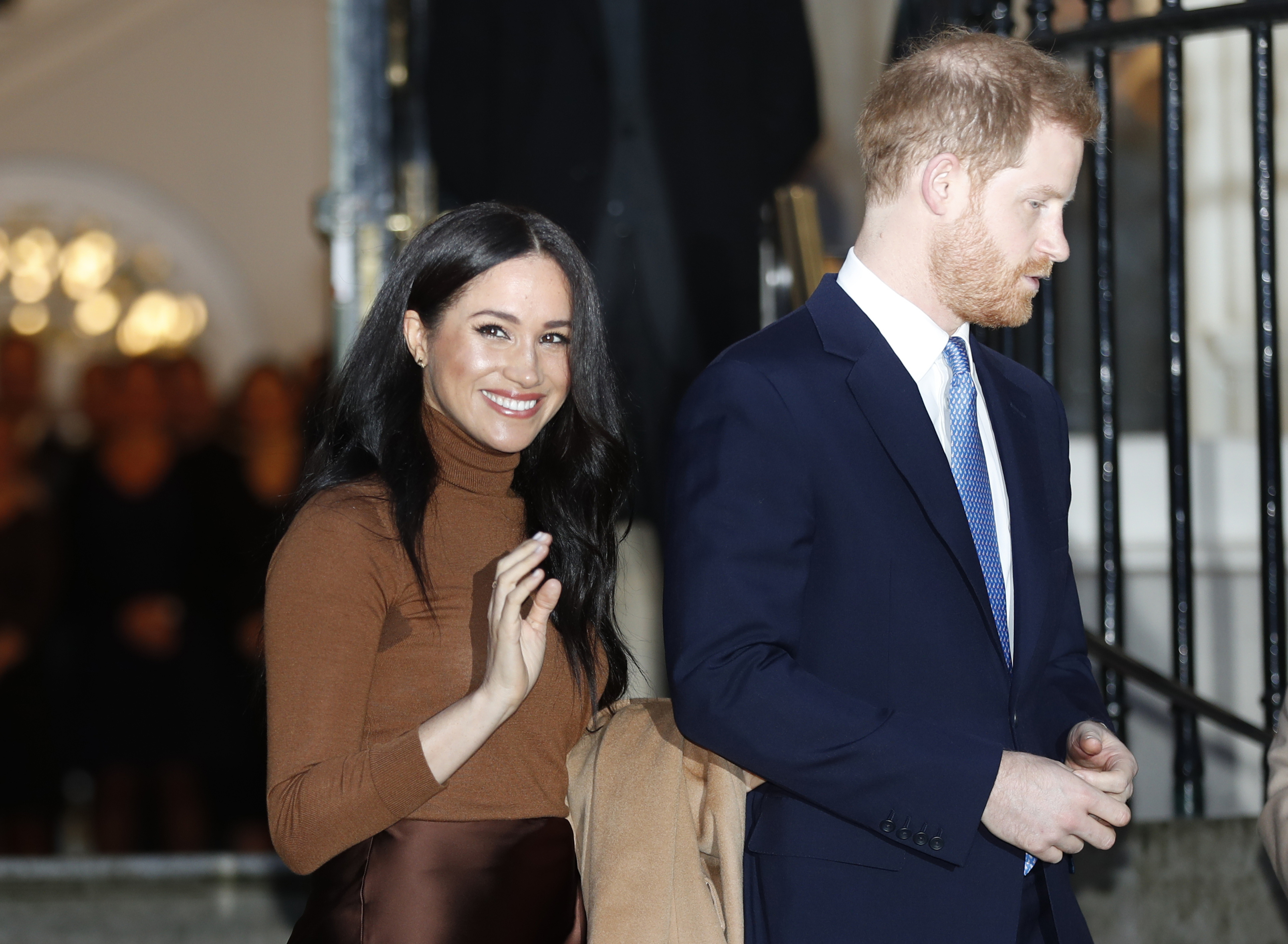 In this Tuesday, Jan. 7, 2020 file photo, Britain's Prince Harry and Meghan, Duchess of Sussex smile as they leave Canada House, in London.