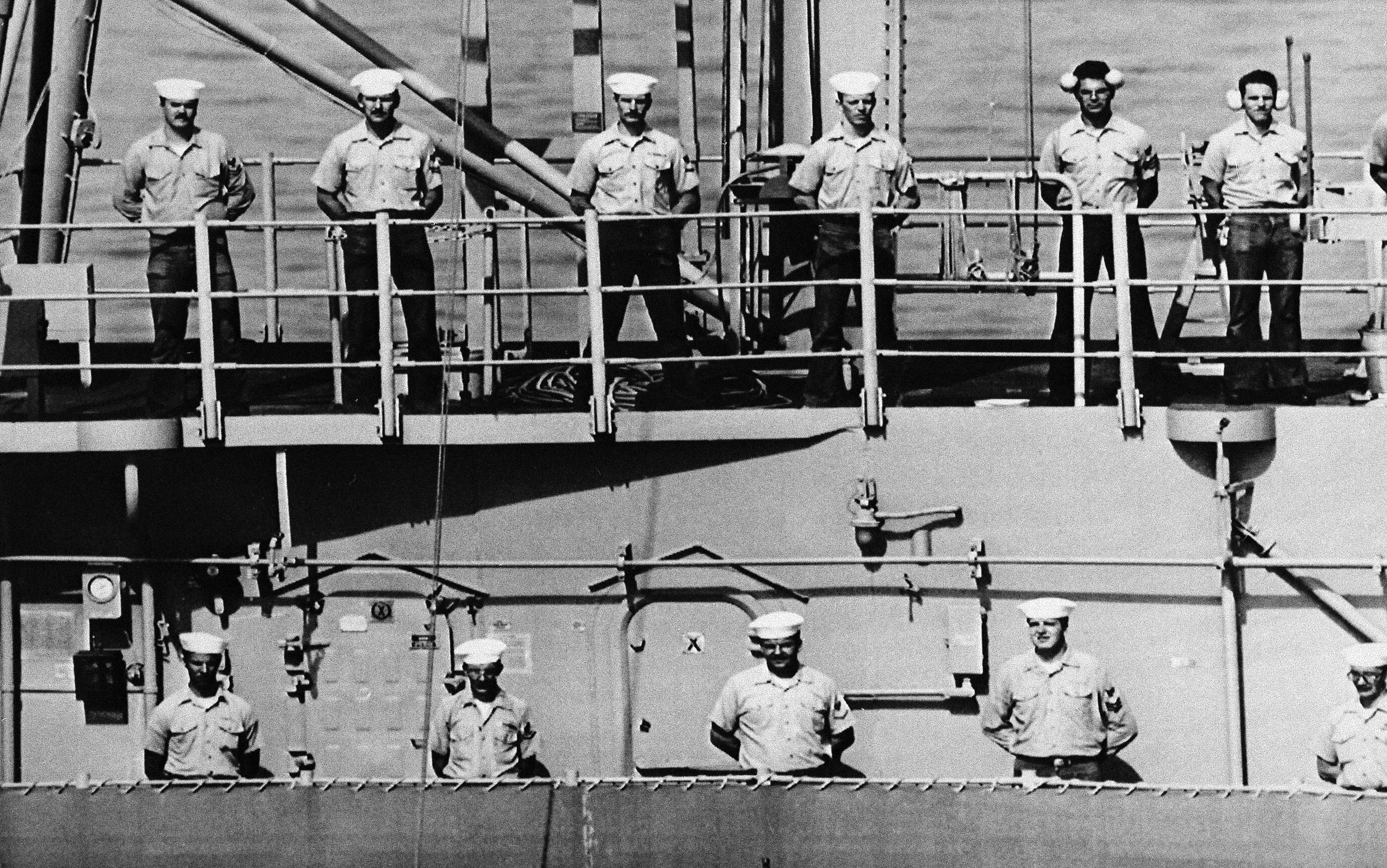 File photo: The crew of the USS Vincennes stands at attention to salute the USS Samuel B. Roberts which left the Persian Gulf.