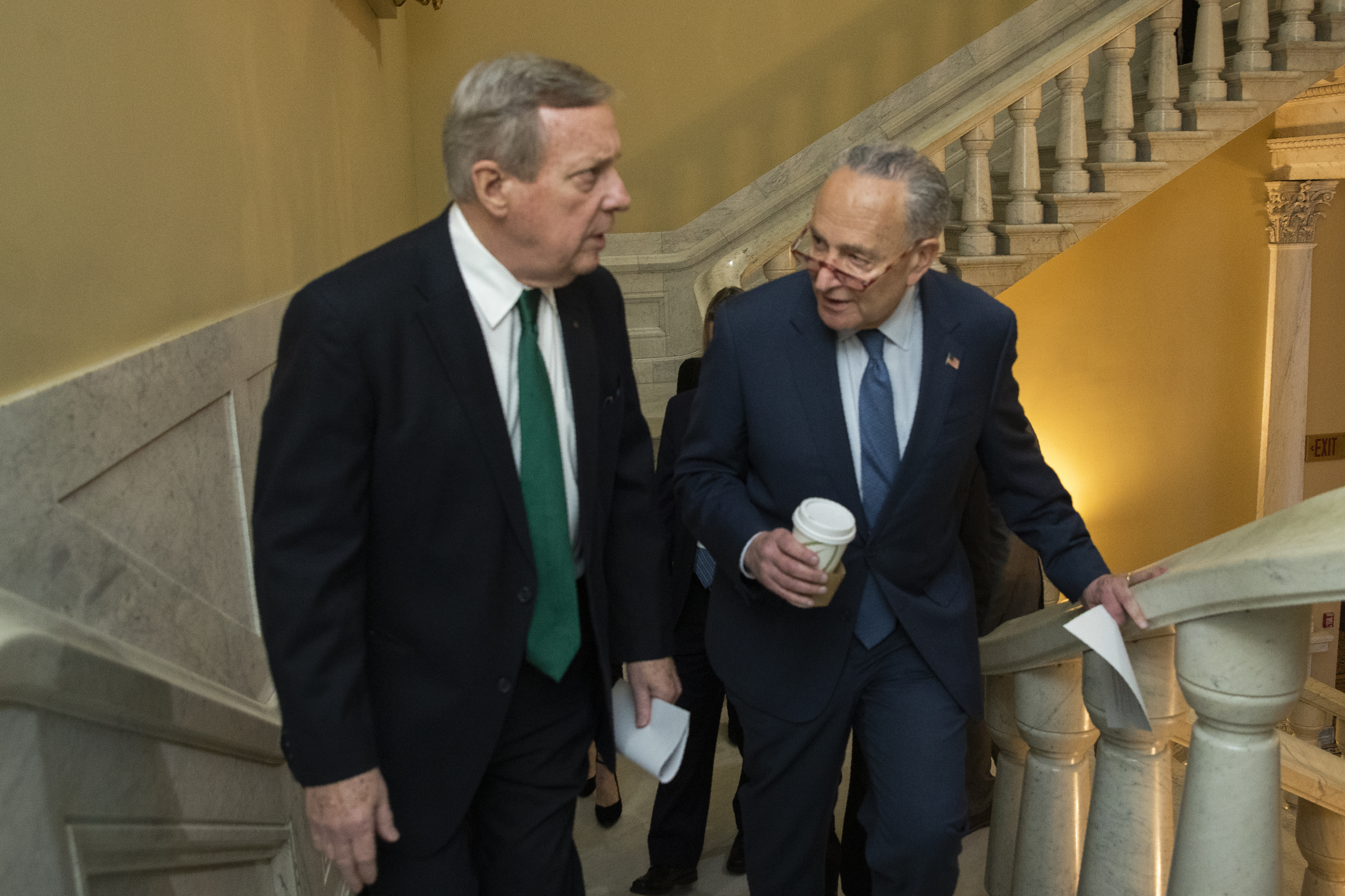 Democratic leader Sen. Chuck Schumer, D-N.Y., right, and Sen. Dick Durbin, D-Ill., walk on the steps in the US Capitol on the first full day of the impeachment trial of US President Donald Trump.