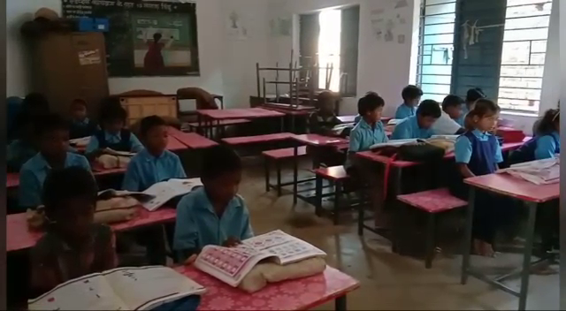 children studying in shabby school building