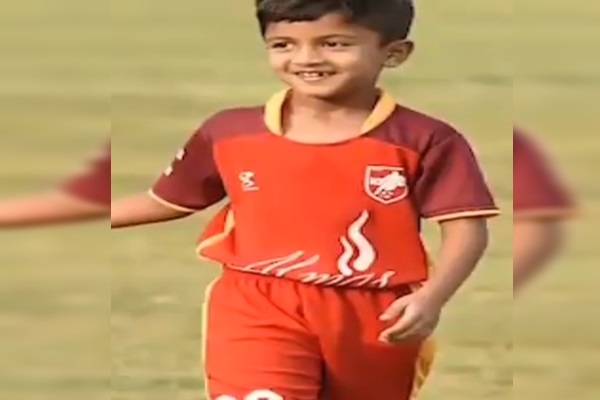 10 year old zero degree corner kick boy focused on football only