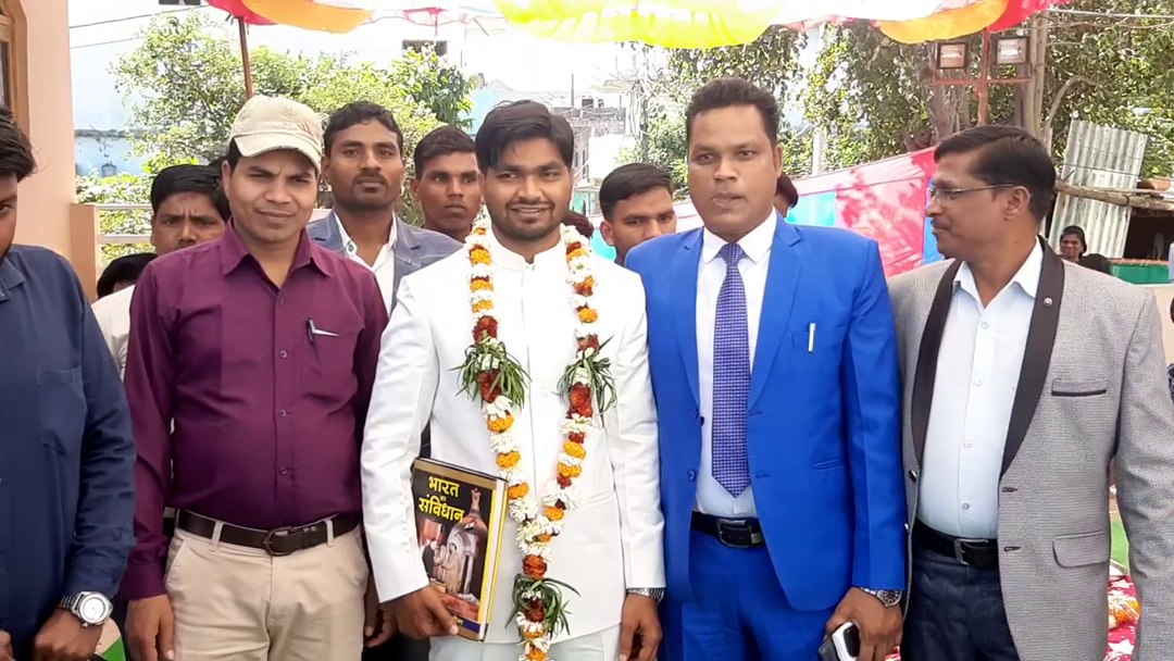 The groom brought the procession with the book of the constitution in his hand