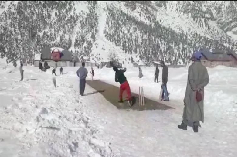 Kashmiri youth play cricket.