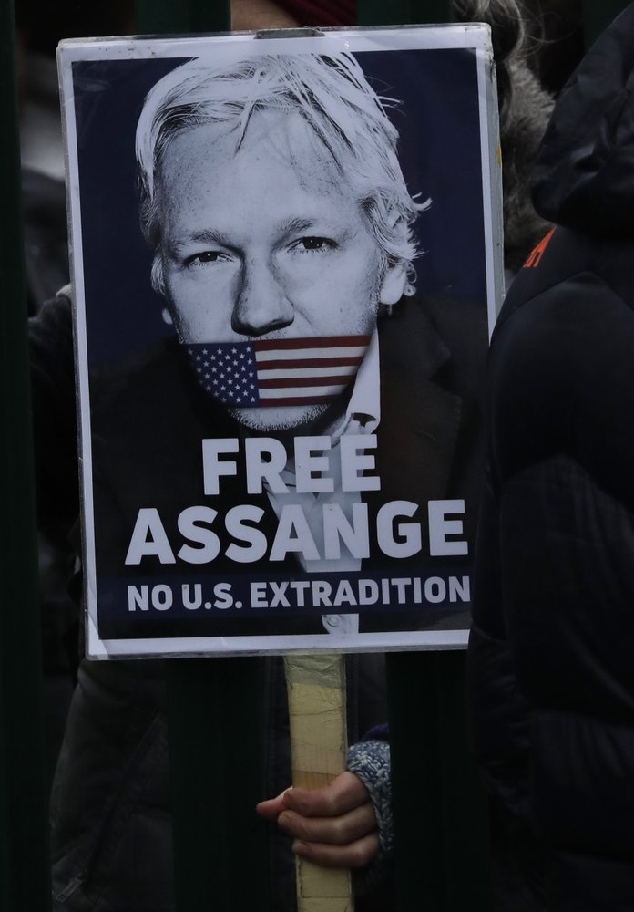 A supporter hold a placard which reads 'Free Assange' as she protests against the extradition of Wikileaks founder Julian Assange outside Belmarsh Magistrates Court