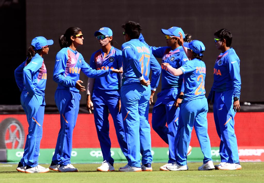 Indian players celebrate fall of a wicket