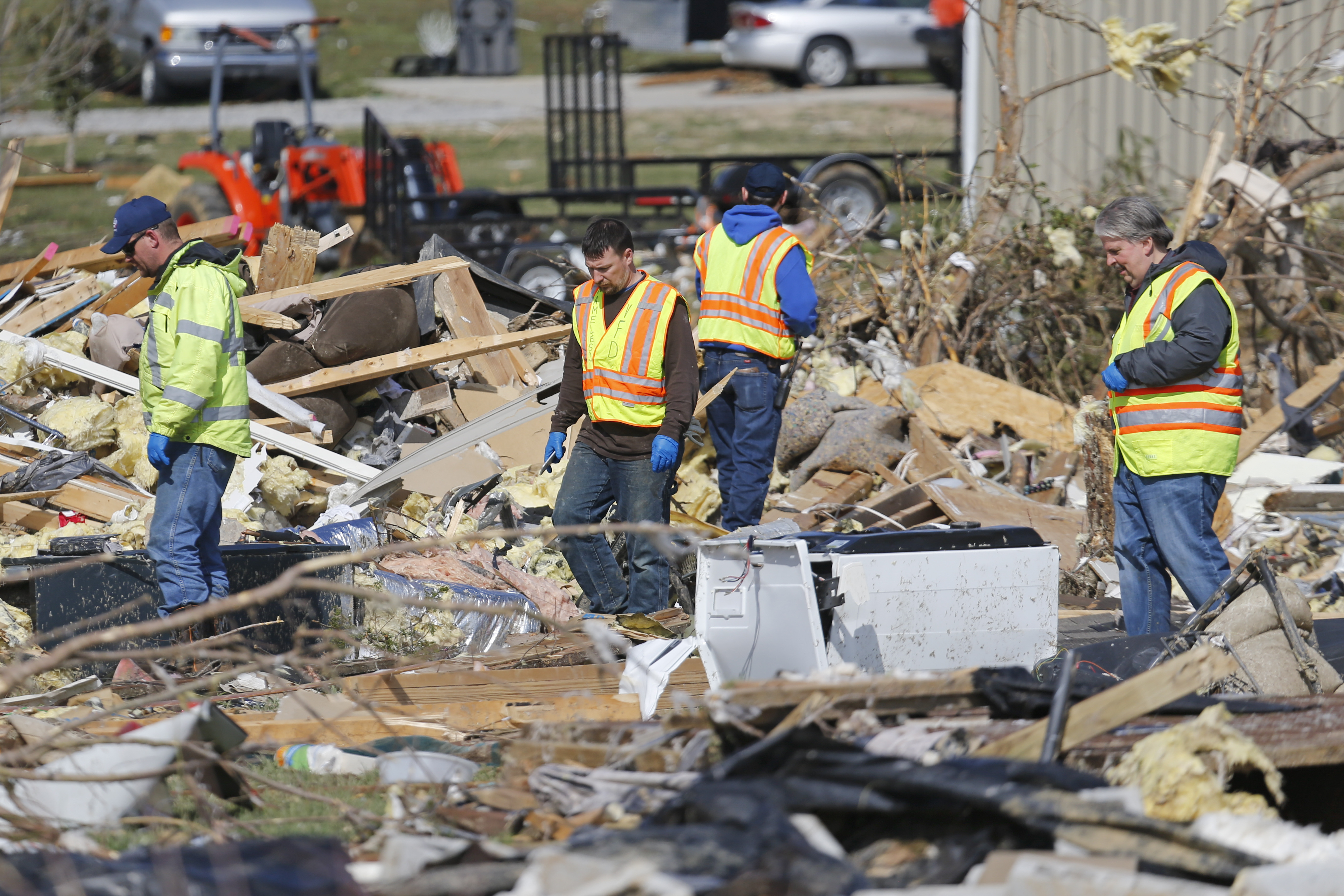 Workers search for victims among the rubble in an area where several people were killed by storms Tuesday, near Cookeville, Tenn.