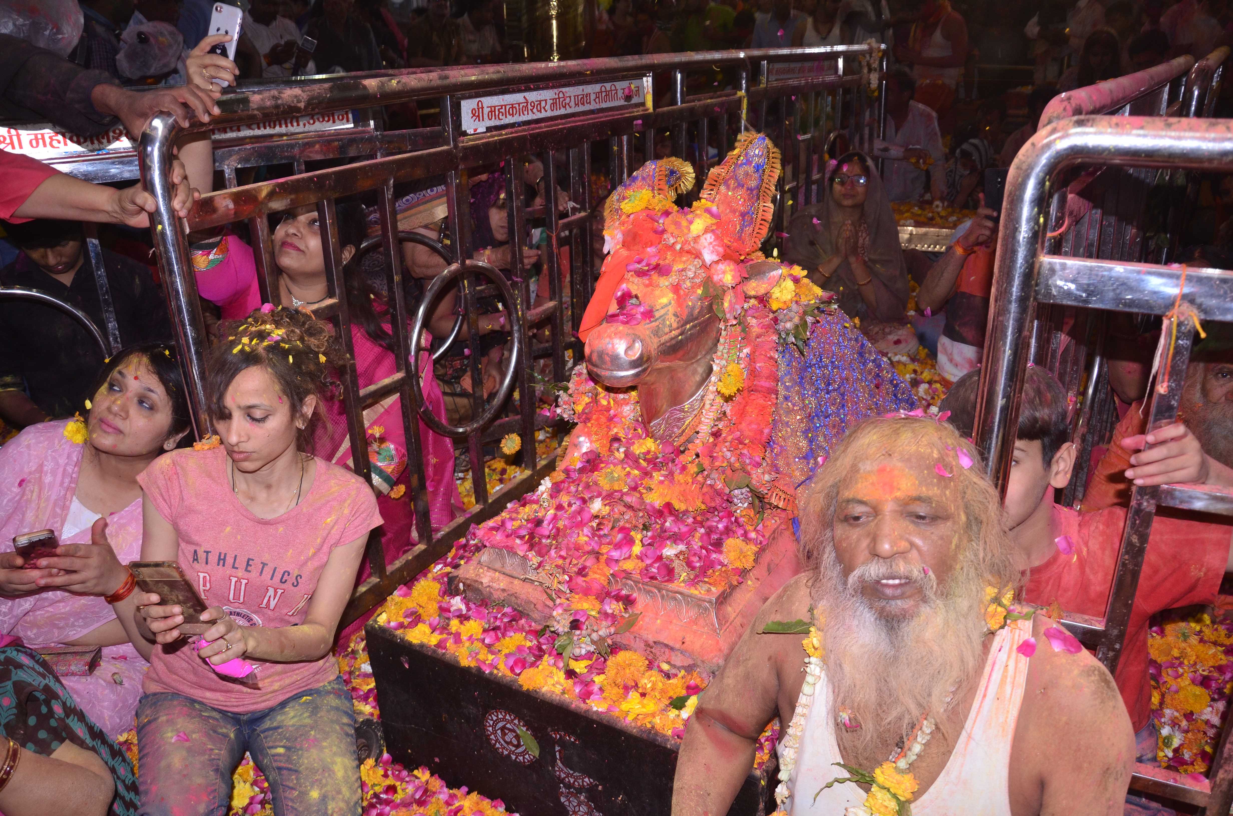 Devotees play Holi with Baba