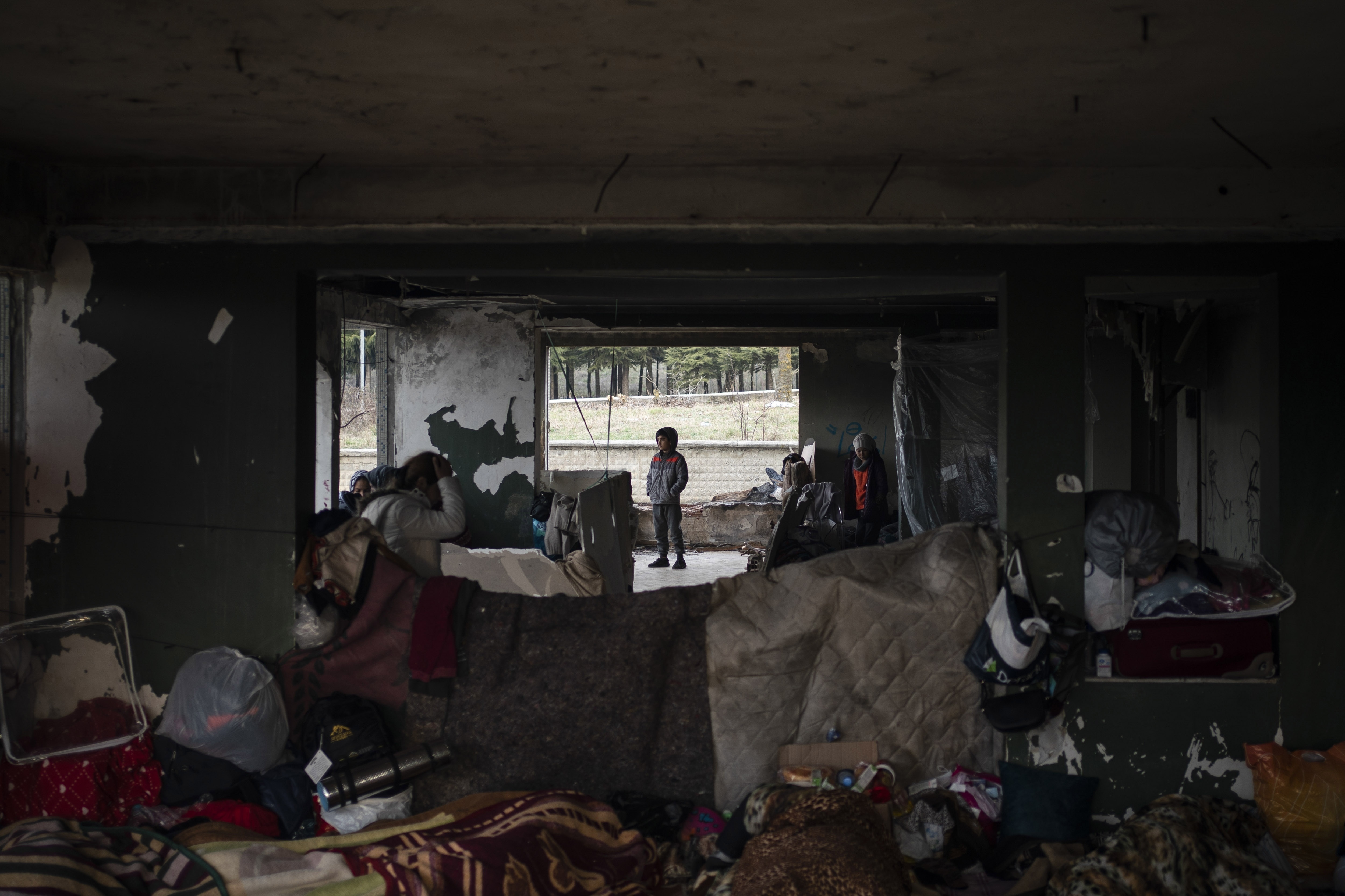 Migrants gather at an abandoned building in Edirne, near the Turkish-Greek border on Friday.