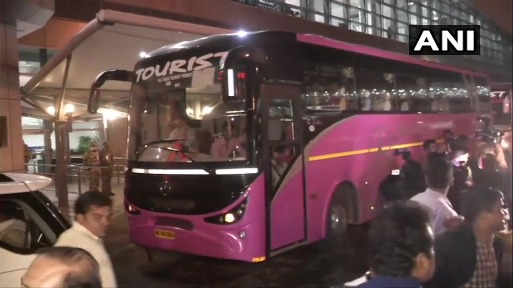 MLA left in pink color bus