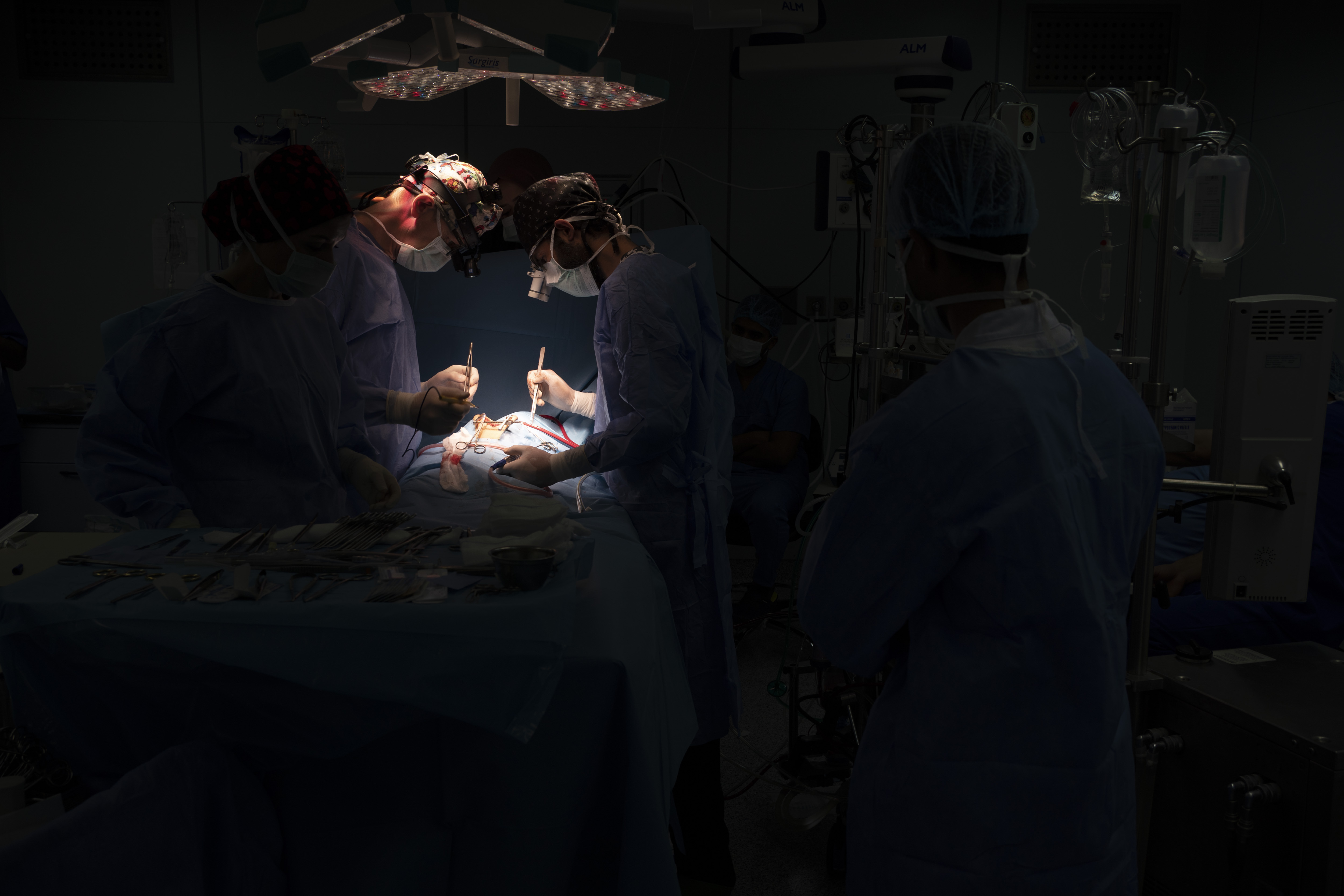 Dr. Vitaly Dedovich, center left, of the Novick Cardiac Alliance medical team performs open heart surgery on Yazan, 1, at the Tajoura National Heart Center in Tripoli, Libya.