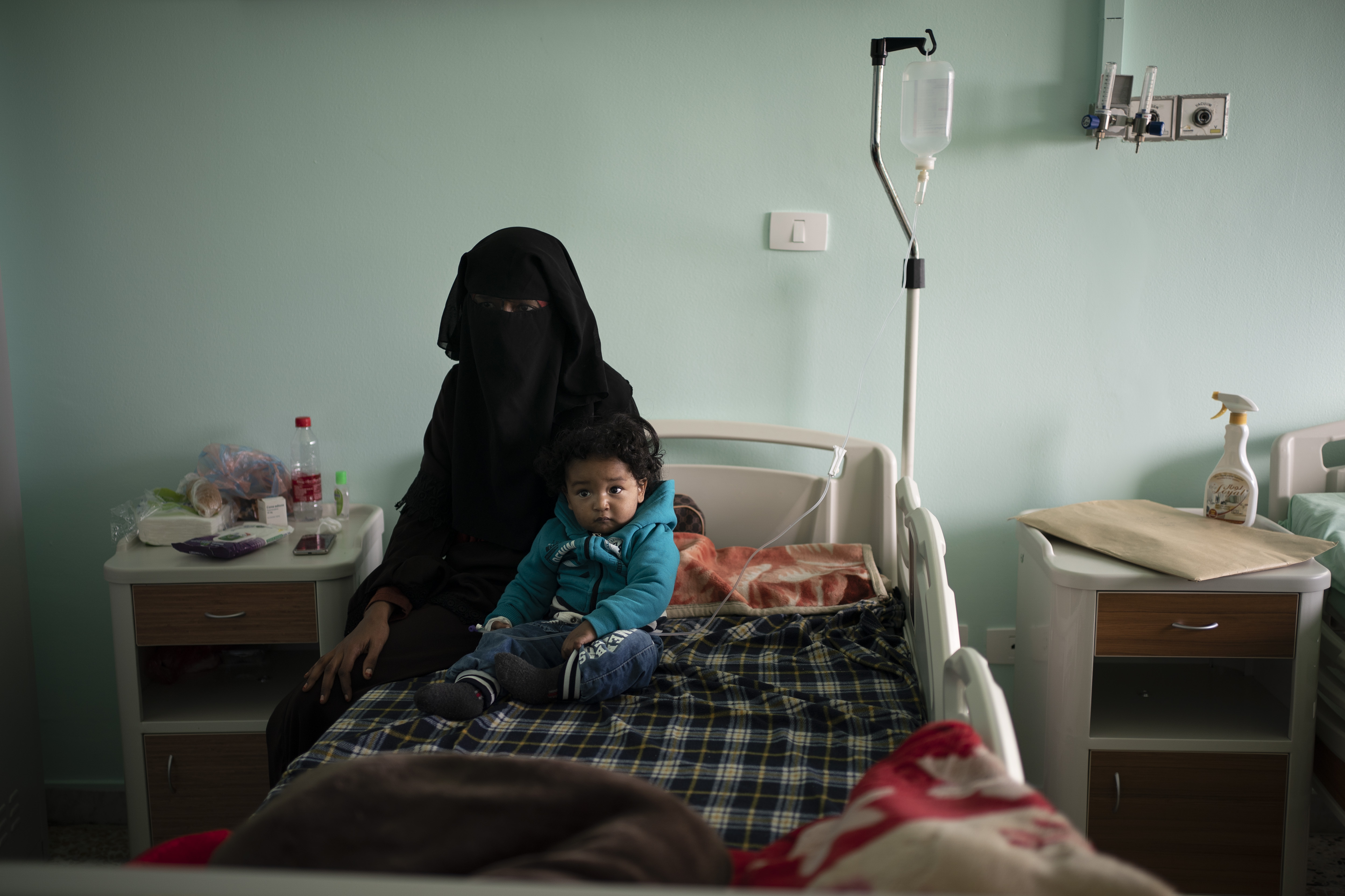 Yazan, 1, sits with his mother before his heart surgery at the Tajoura National Heart Center in Tripoli, Libya.