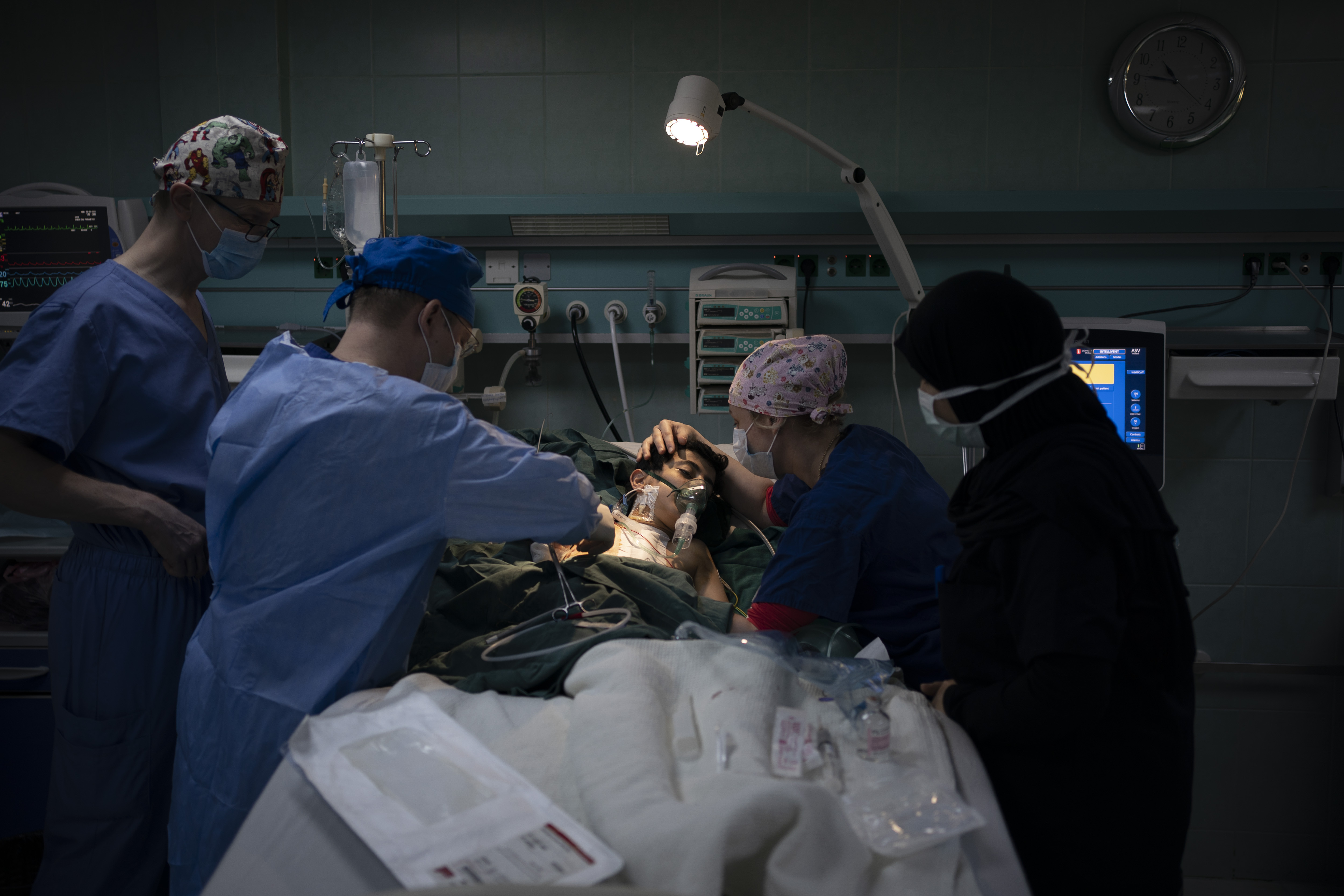 Dr. Vitaly Dedovich, center left, of the Novick Cardiac Alliance medical team performs open heart surgery on Yazan, 1, at the Tajoura National Heart Center in Tripoli, Libya.