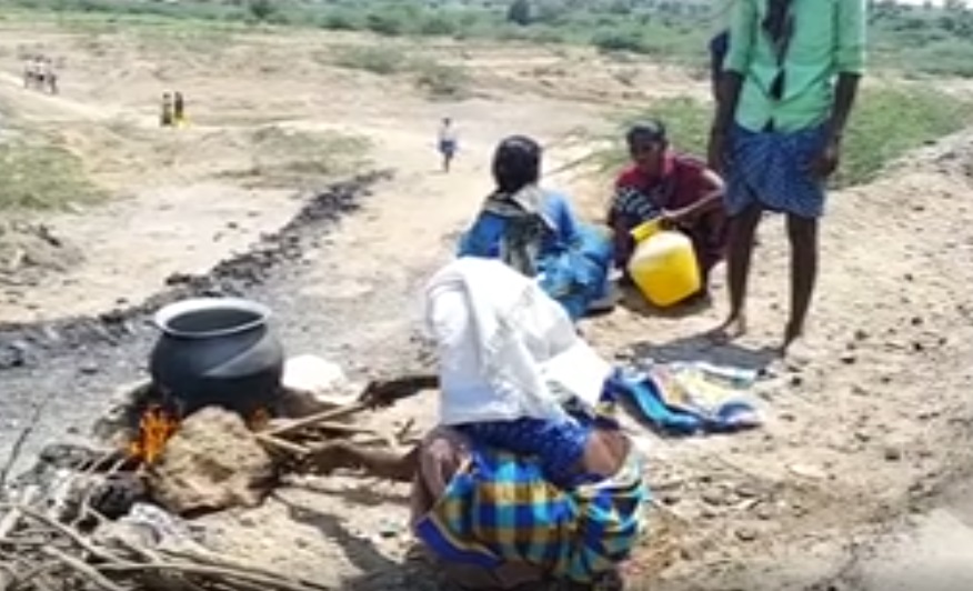 Workers cooking food on the road