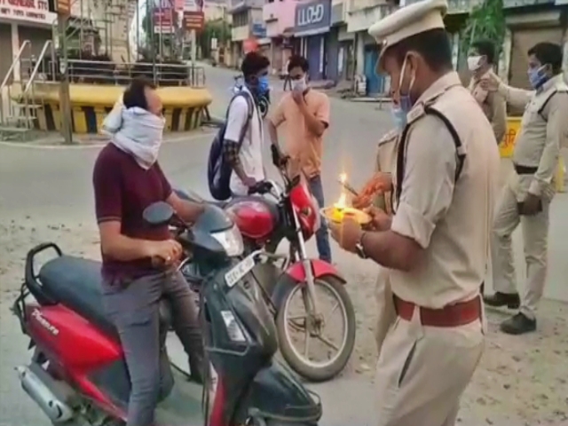 Policemen performing aarti