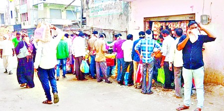 keep distance between two people at markets and kirana general stores in  kumaram bheem asifabad district