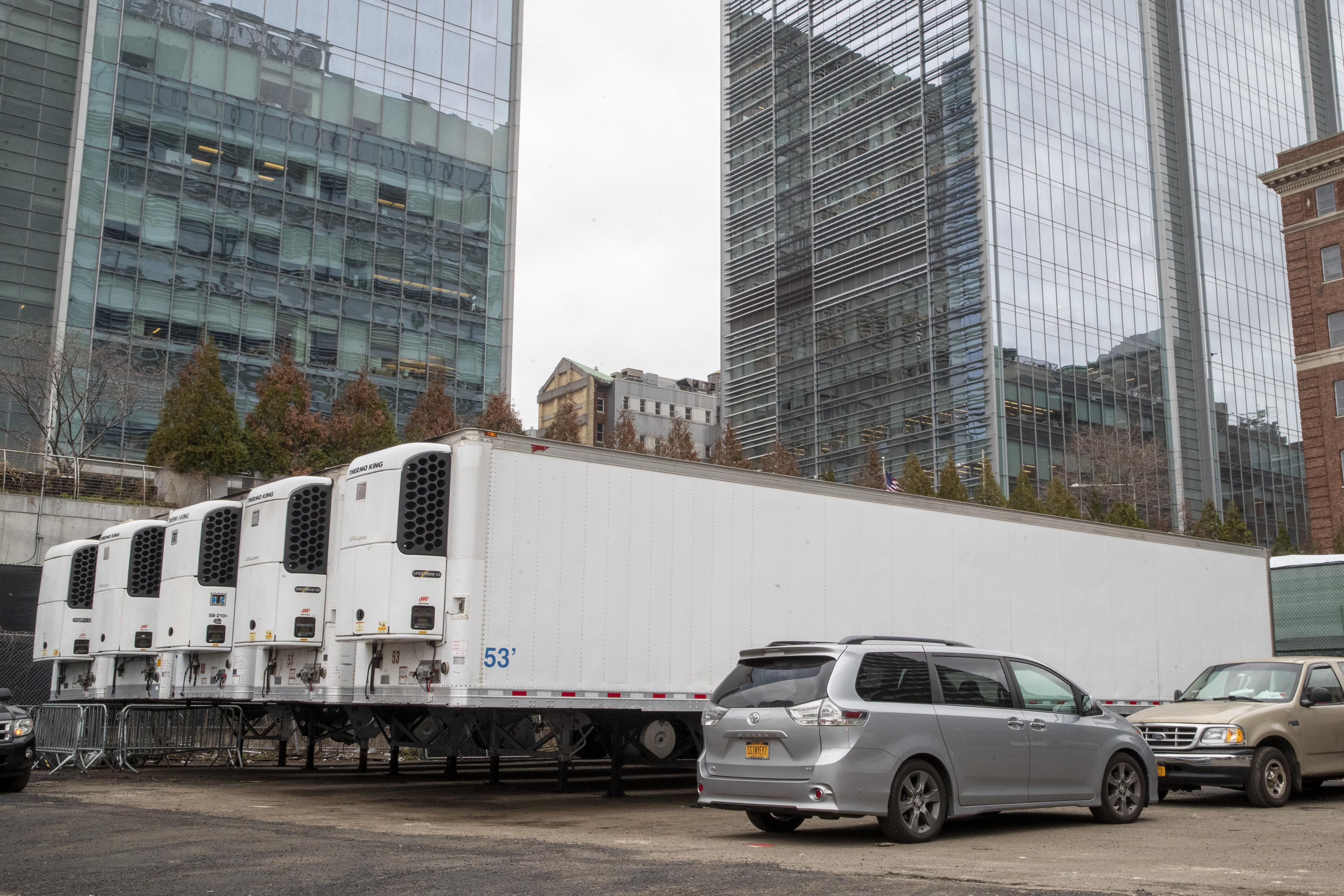 Refrigerated trailers are seen parked at the site of a makeshift morgue being built in New York