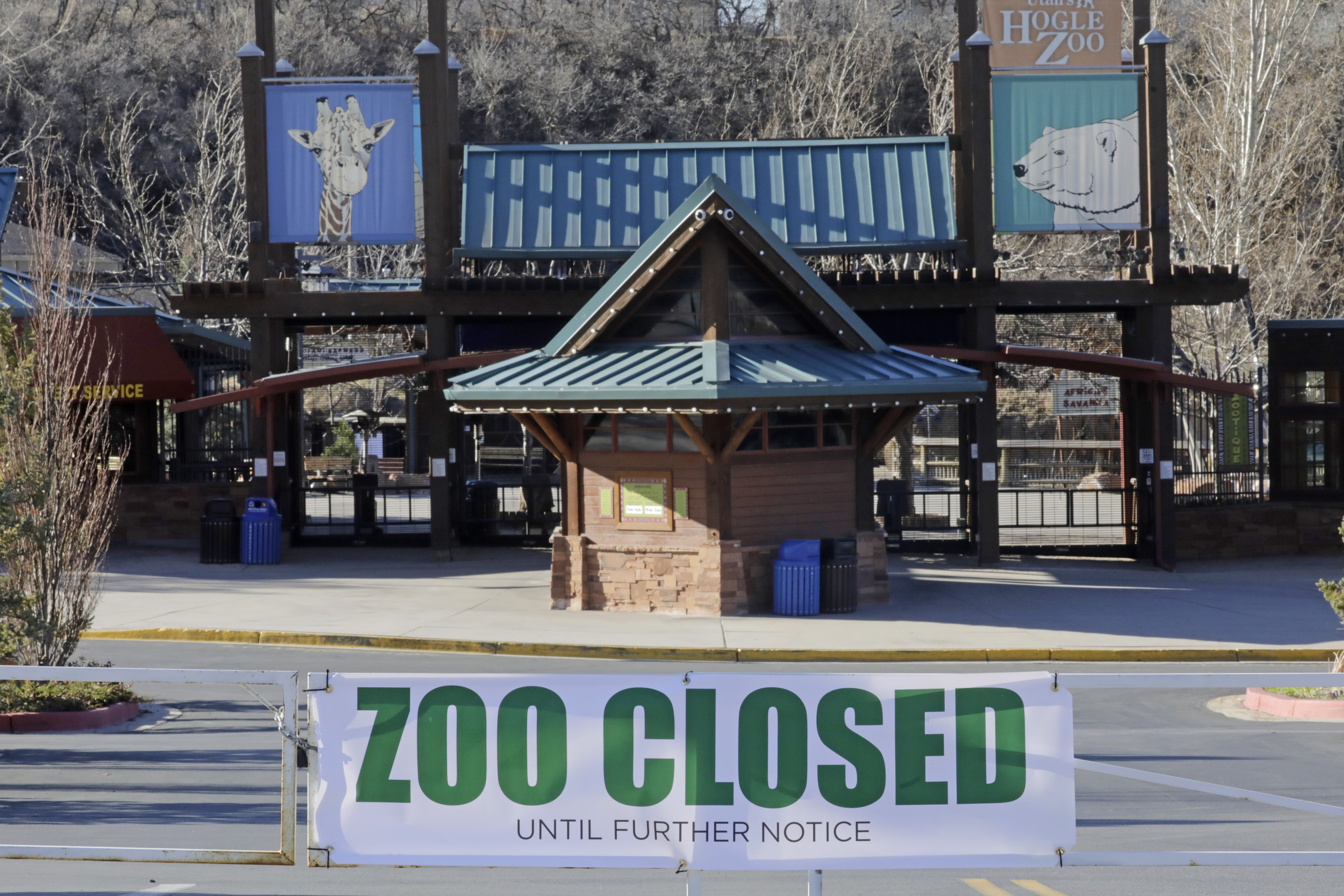 File photo shows a closed sign in front of the Hogle Zoo, who has decided to close effective Tuesday until further notice due to coronavirus