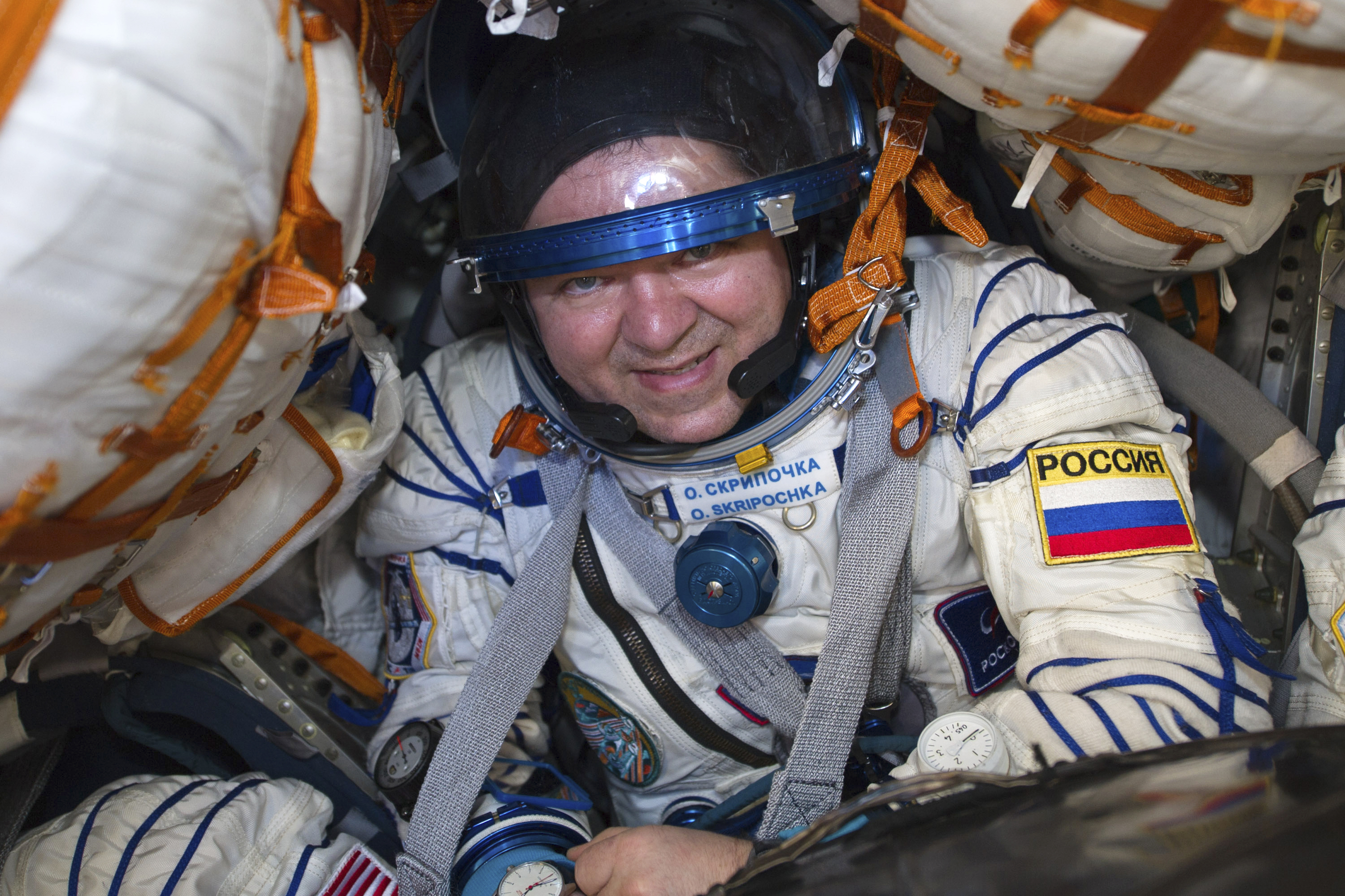 Russian space agency Roscosmos' Oleg Skripochka sits in the capsule shortly after the landing of the Russian Soyuz MS-15 space capsule near Kazakh town of Dzhezkazgan, Kazakhstan, on Friday.